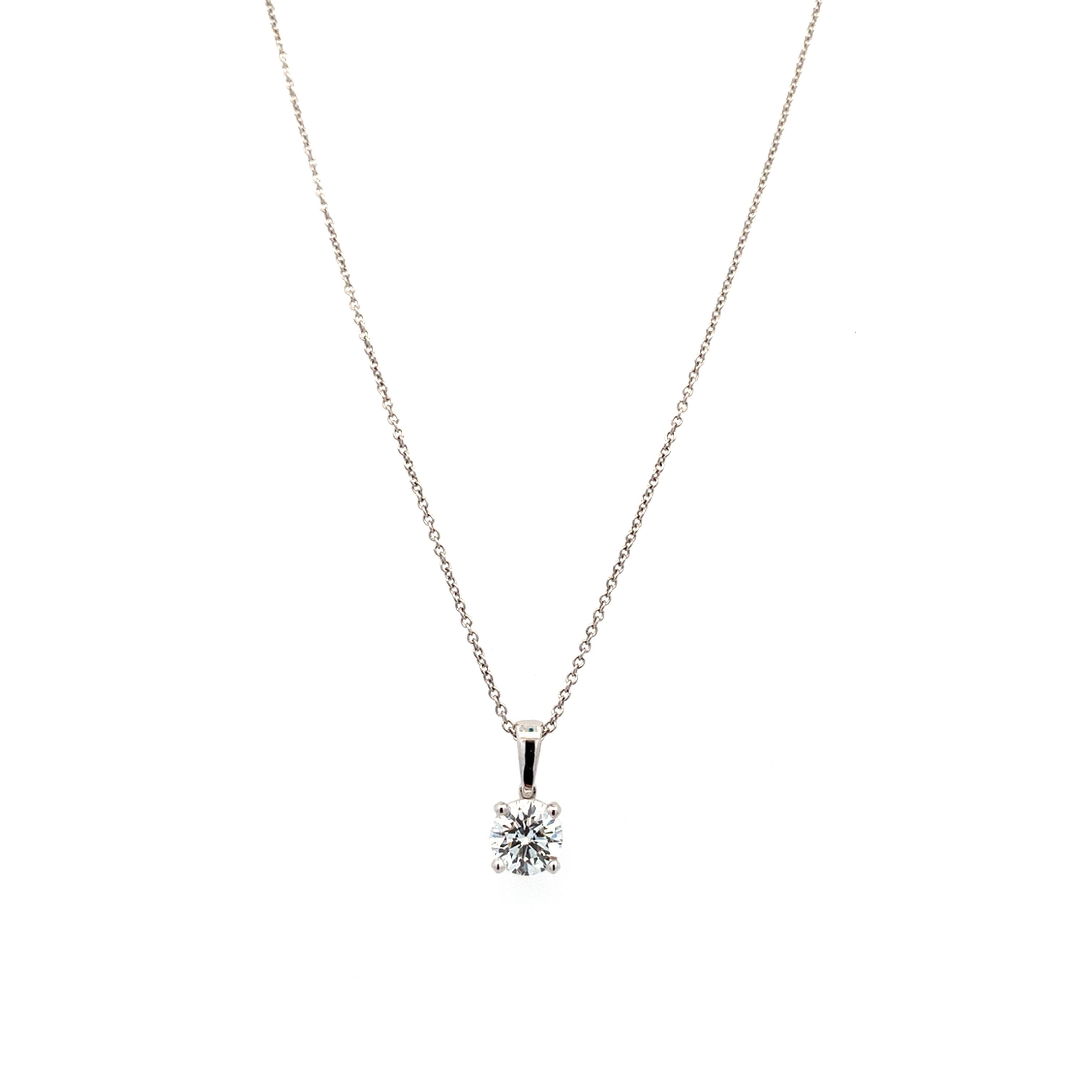 This stunning diamond pendant necklace is the epitome of elegance. Crafted with precision, the sparkling 0.71ct F SI2 diamond is beautifully suspended from a delicate 16 inches chain, making it the perfect accessory for any occasion. Whether you're