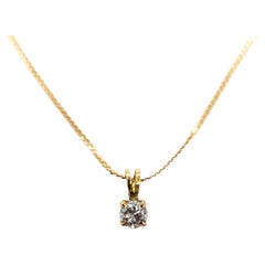 Collana con ciondolo solitario con diamante in oro giallo 14k