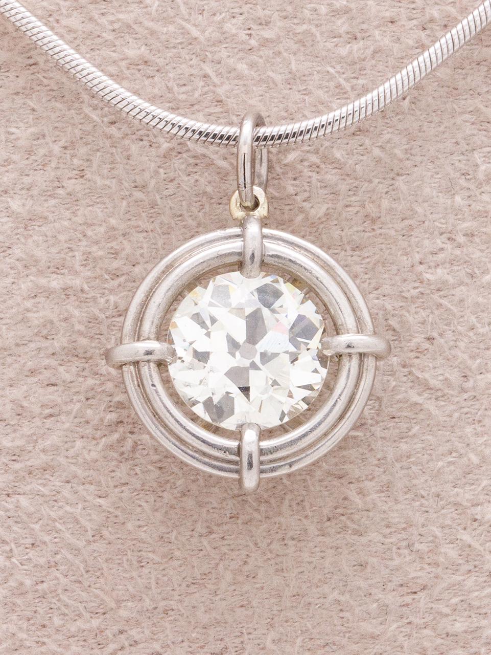Stunning custom diamond solitaire pendant necklace set in platinum featuring a bright and lively 1.41ct Old European Cut, J-VS2. The simple, modern pendant is complimented by a 16 inch long contemporary 1mm platinum snake chain. This piece can be