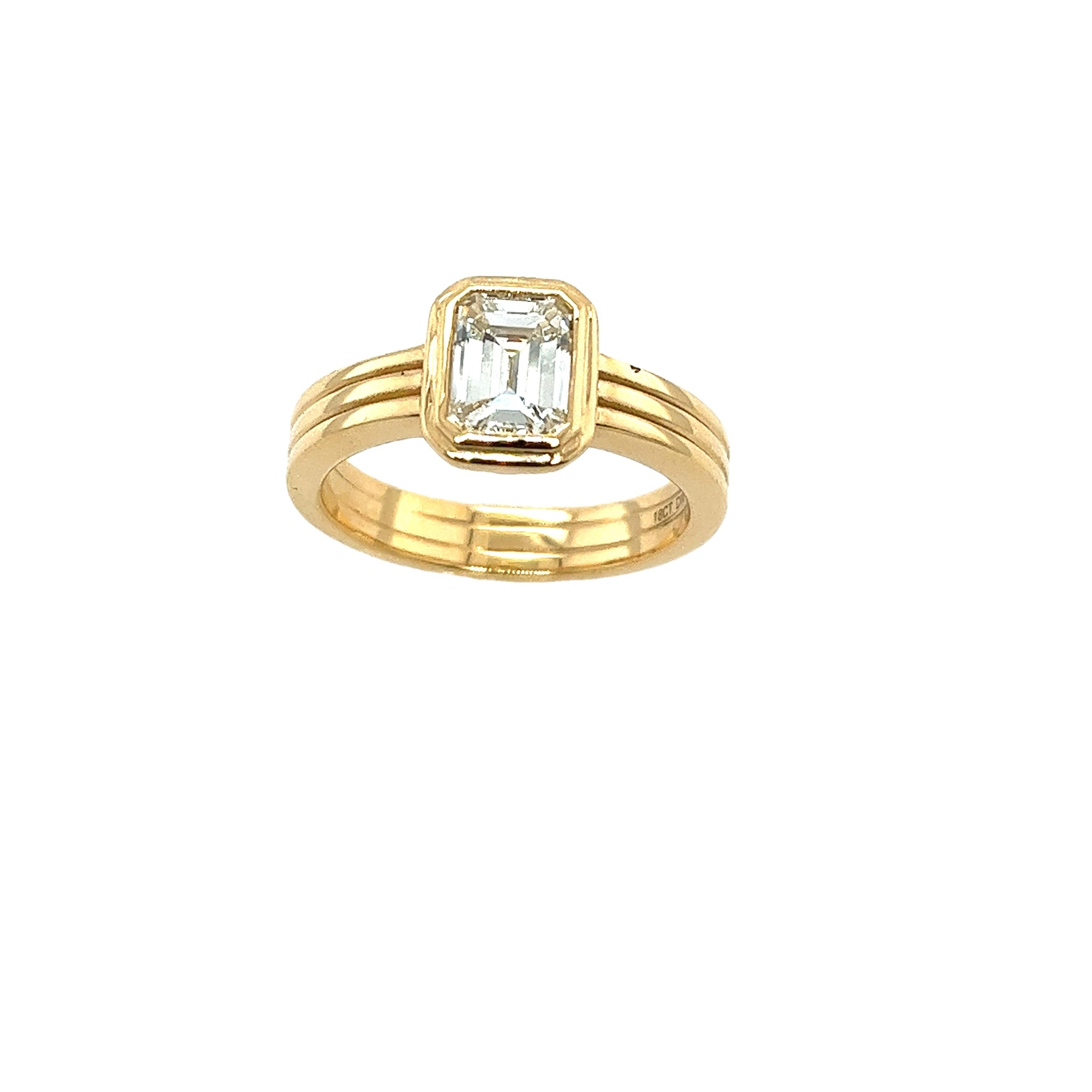 This gorgeous solitaire diamond ring set with 
1.01ct K/VS2 natural emerald cut diamond 
set in 18ct yellow gold 3 band setting 
can make a perfect engagement ring.
Total Diamond Weight: 1.01ct
Diamond Colour: K
Diamond Clarity: VS2
Width of Band: