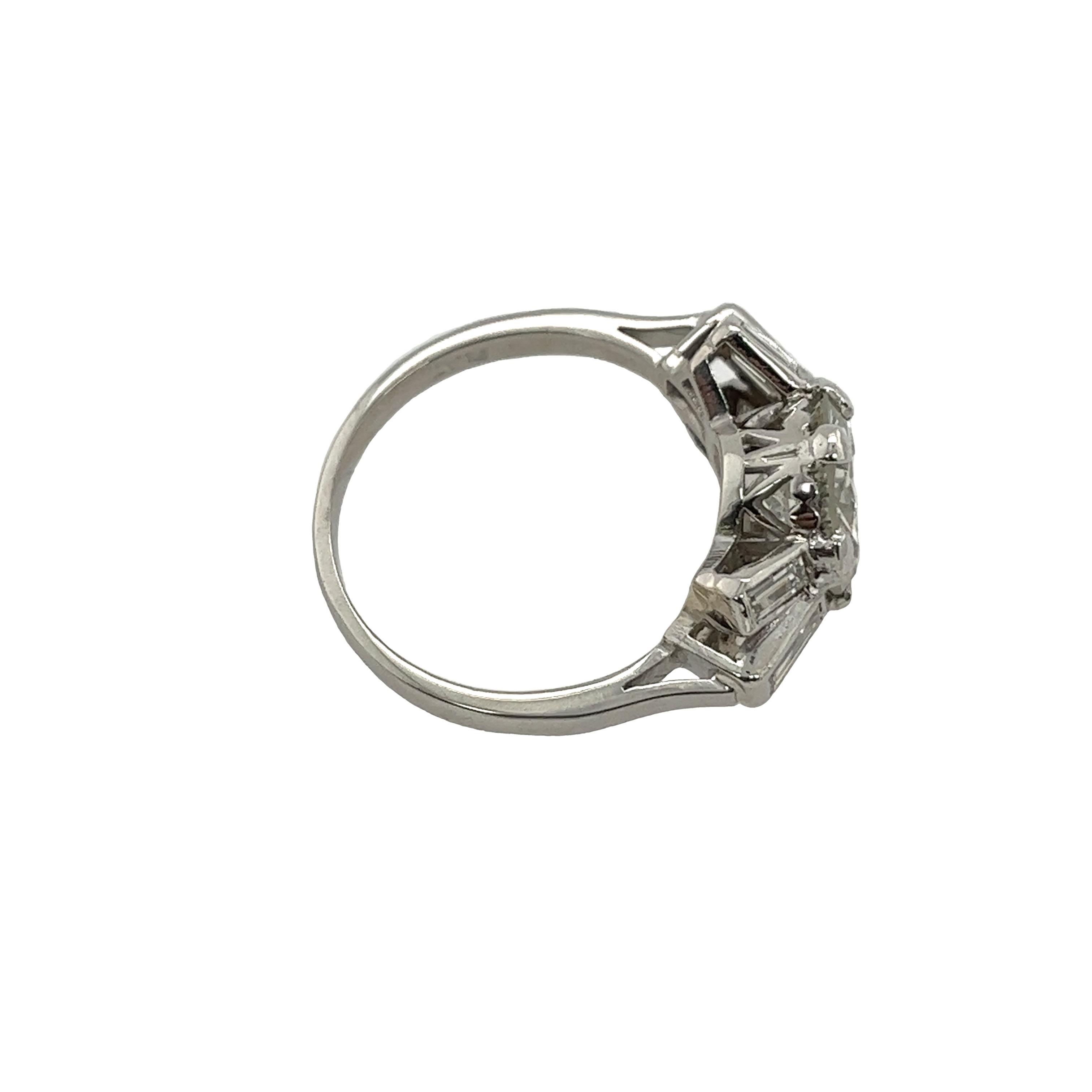 Women's Diamond Solitaire Ring Set With 2.62ct L/I2 & 4 Baguette Diamonds For Sale