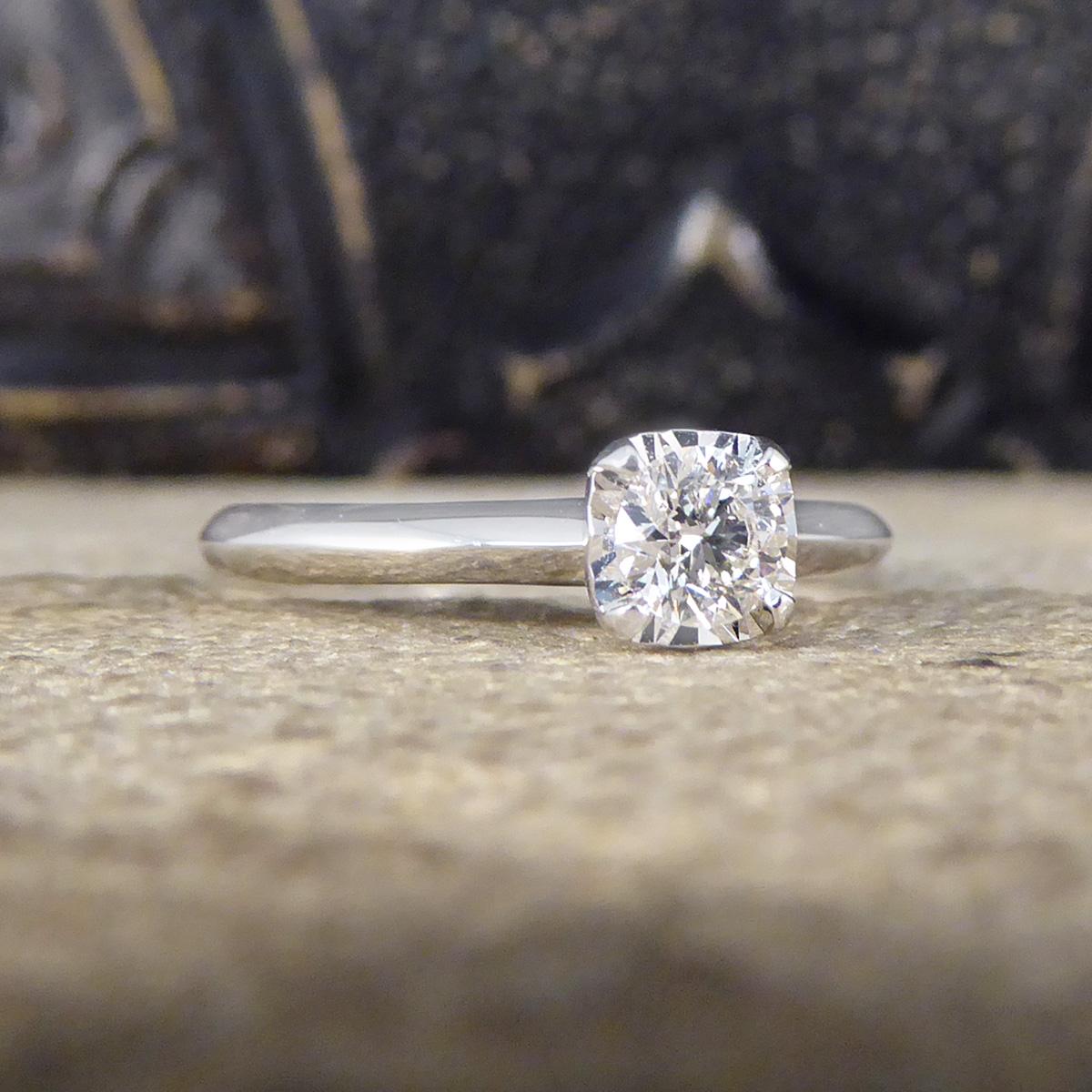 The perfect engagement ring that will sparkle beautifully on the finger. This ring holds a 0.30ct Round Cut Diamond in a cushion shaped illusion setting. The setting allows the Diamond to look larger than it is with a cushion shapes giving a classic