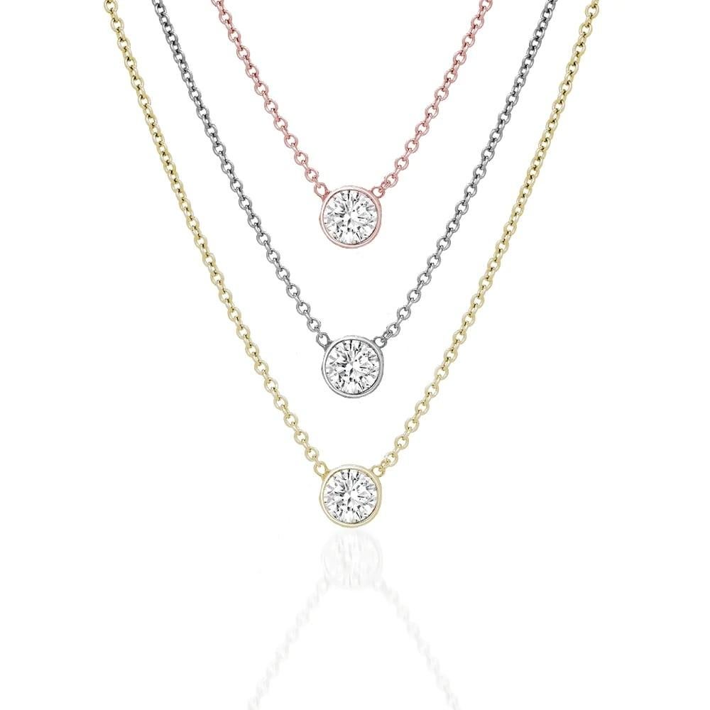 This diamond necklace features an elegant round diamond in 14k gold

Necklace Information 
Gold : 14k
Setting : Bezel
Clasp : Lobster Claw Clasp
Color : Rose Gold, Yellow Gold, White Gold
Diamond Cut : Round Natural Diamond
Diamond Color :