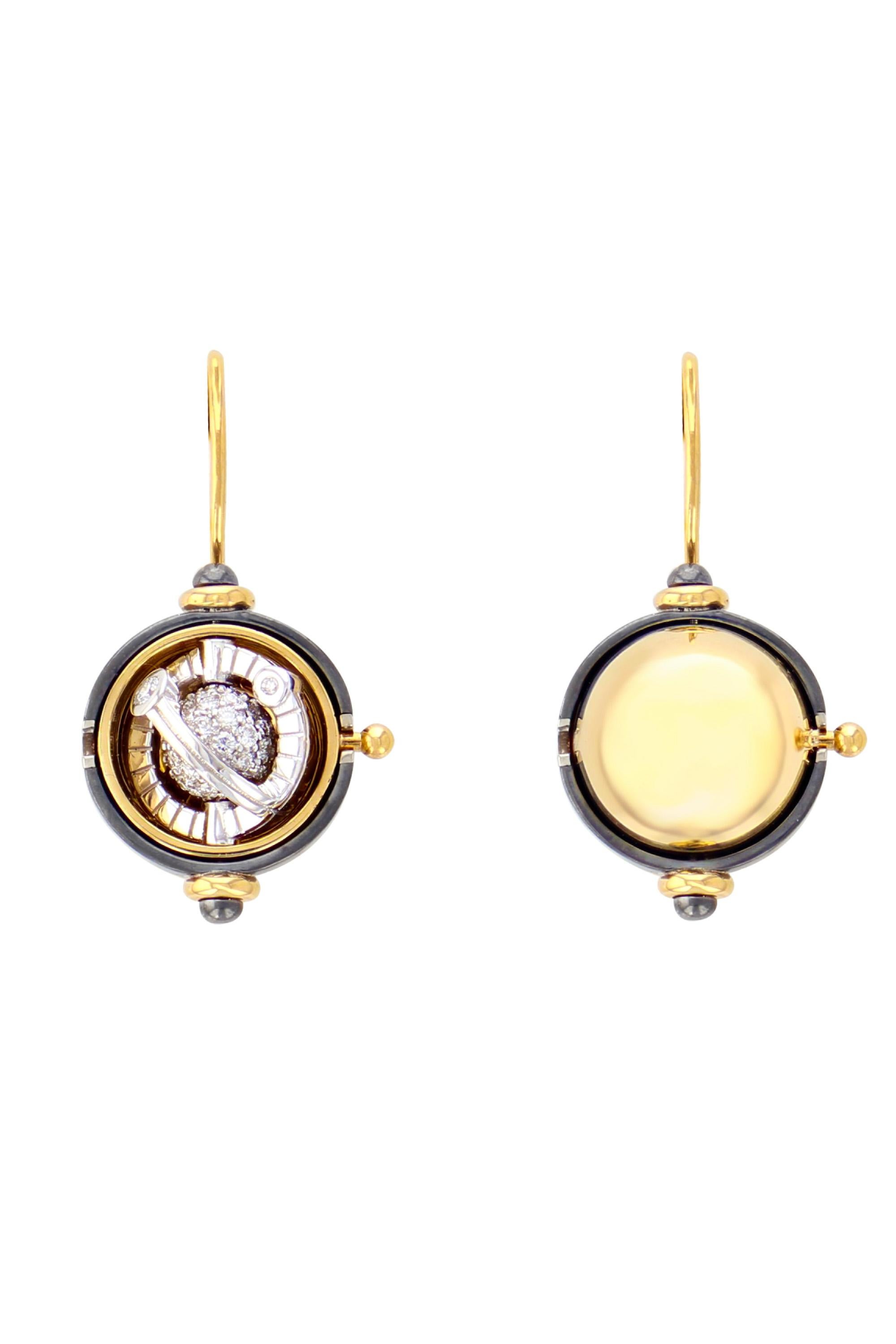 Gold and distressed silver earrings. Rotating sphere revealing a diamond encircled by a white gold ring  set with a diamond.

Details:
Diamonds: 0.9 cts
18k Yellow Gold: 12 g
Distressed Silver : 7 g
Made in France