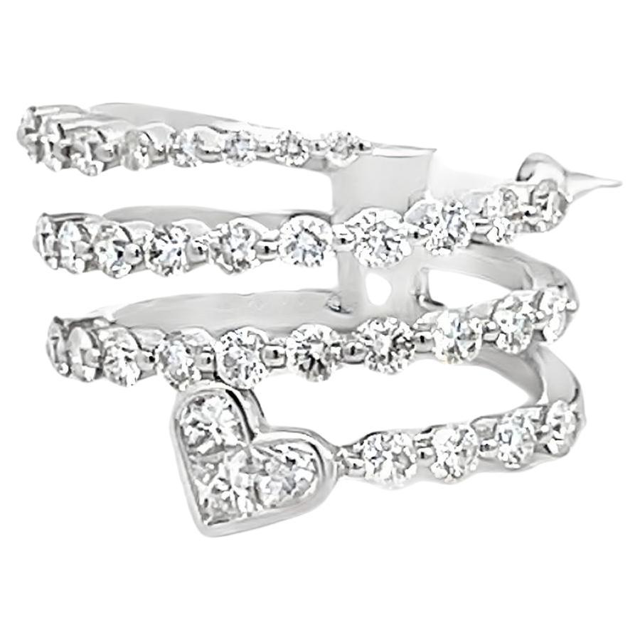 Crafted in 18K white gold, the ring features a spiral bypass diamond design that wraps delicately around the finger. It sparkles with 35 round brilliant-cut diamonds set in shared prongs, totaling 1.42 carats. 
Adding a unique touch, a diamond