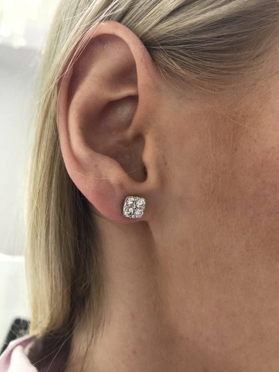 These eye catching elegant Round Brilliant Diamond cluster stud earrings featuring white colour H - clarity SI diamonds that sparkle, set in 18 Karat White Gold. These curved-corners square shaped pave set cluster studs have a total diamond weight