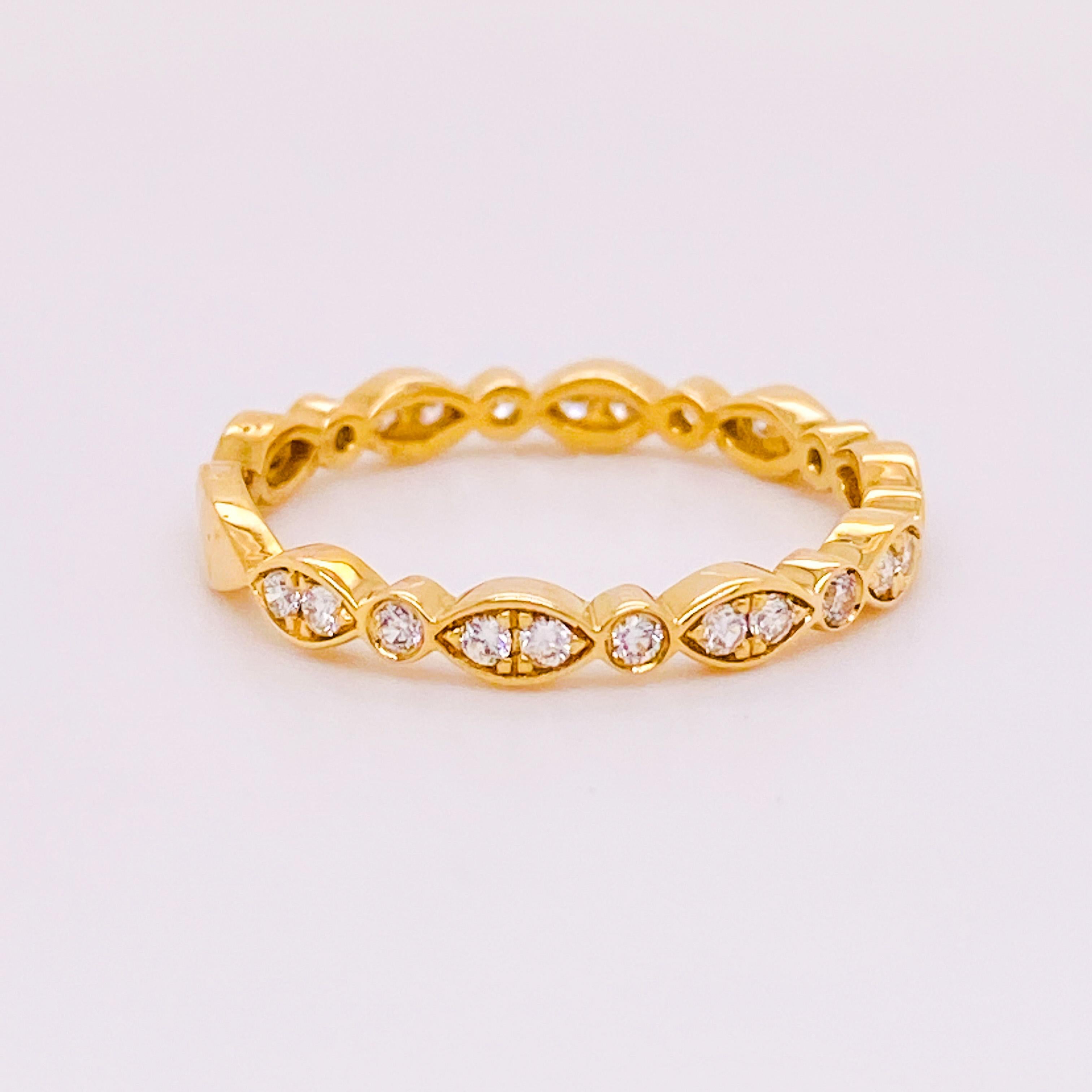 This diamond band is a gorgeous style that has a round and marquise shape alternating.The band is 14 karat yellow and has diamonds going 3/4 the way around the ring. The ring is gorgeous by itself or when stacked with other bands. The diamonds are