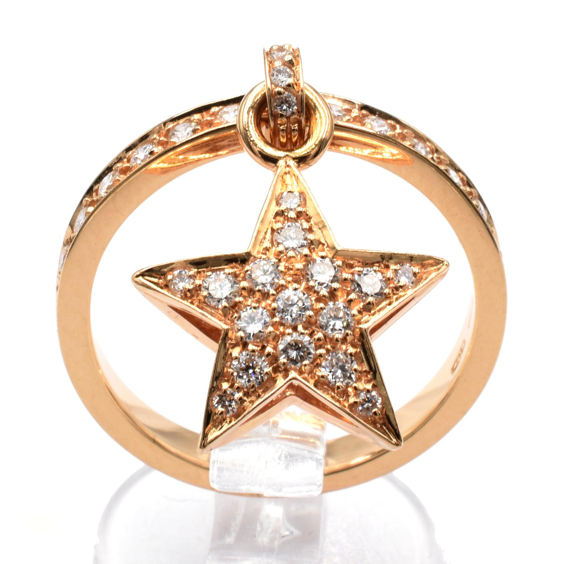 18 Kt Rose Gold Ring with Pendant Star Charm. This Charm is set in both sides with White Diamonds and hangs freely on the ring.
A very Funny and Happy Ring that perfectly match with a wedding ring for an everyday use.
Handmade in Italy in or Atelier