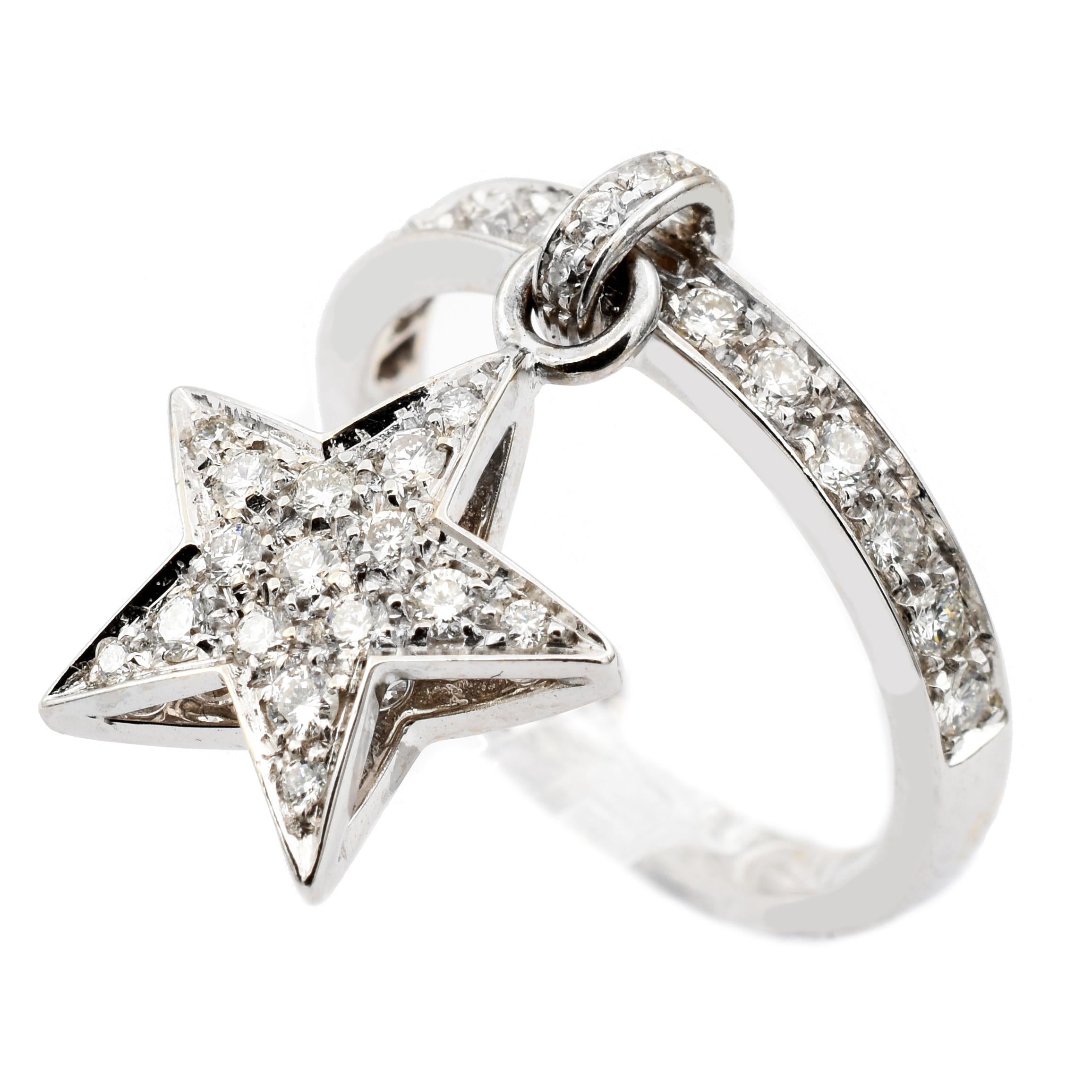 18 Kt White Gold Ring with Pendant Star Charm. This Charm is set in both sides with White Diamonds and hangs freely on the ring.
A very Funny and Happy Ring that perfectly match with a wedding ring for an everyday use.
Handmade in Italy in or
