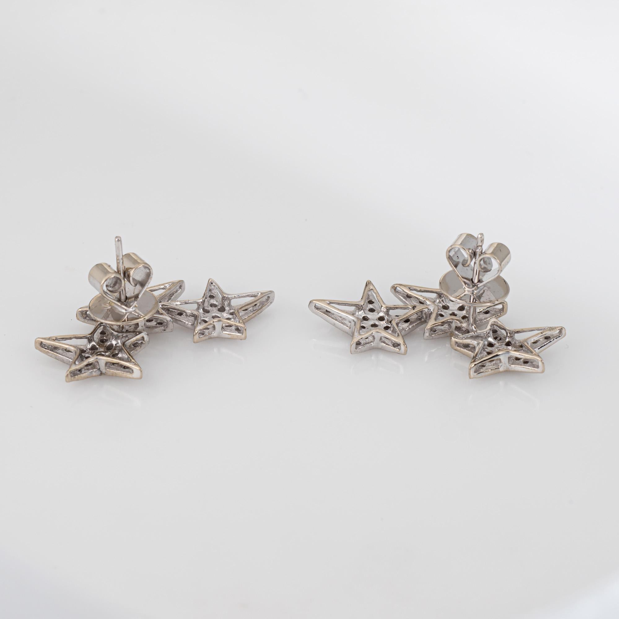 Stylish contemporary diamond star earrings crafted in 18k white gold.

Diamonds total an estimated 0.50 carats (estimated at I-J color and IS1-I1 clarity).    

A nod to the celestial world the three tiered pave set diamond star earrings make a