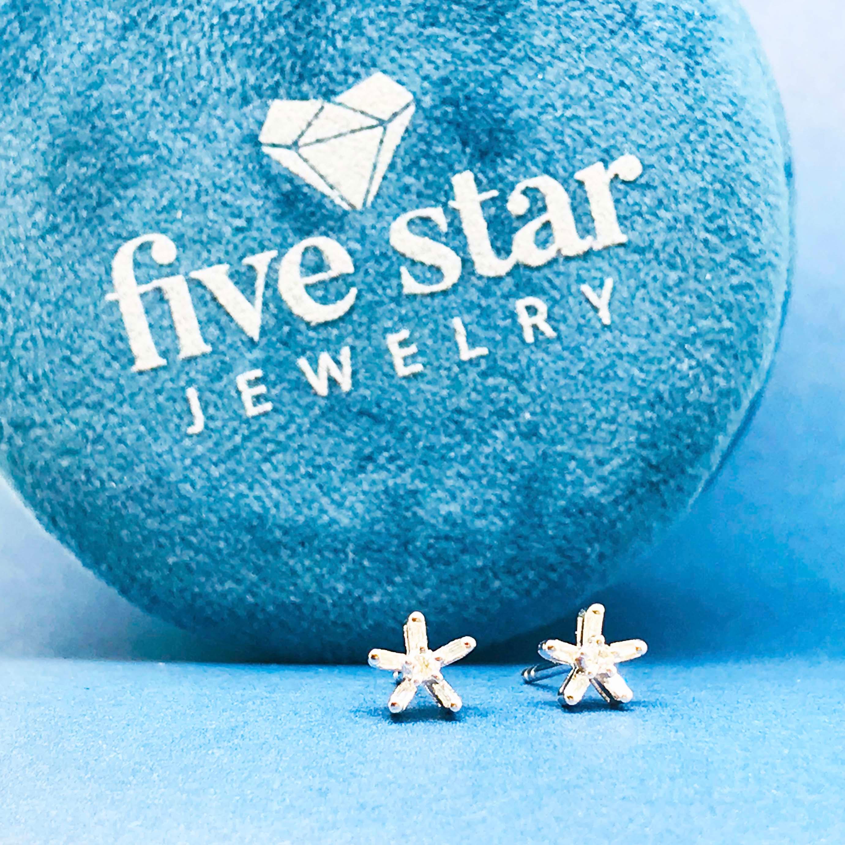 These adorable diamond stud earrings are so cute and fun! The diamond star earring studs have genuine baguette and round diamonds set in a five pointed star design. The earrings are also designed to look like diamond flowers with a round brilliant