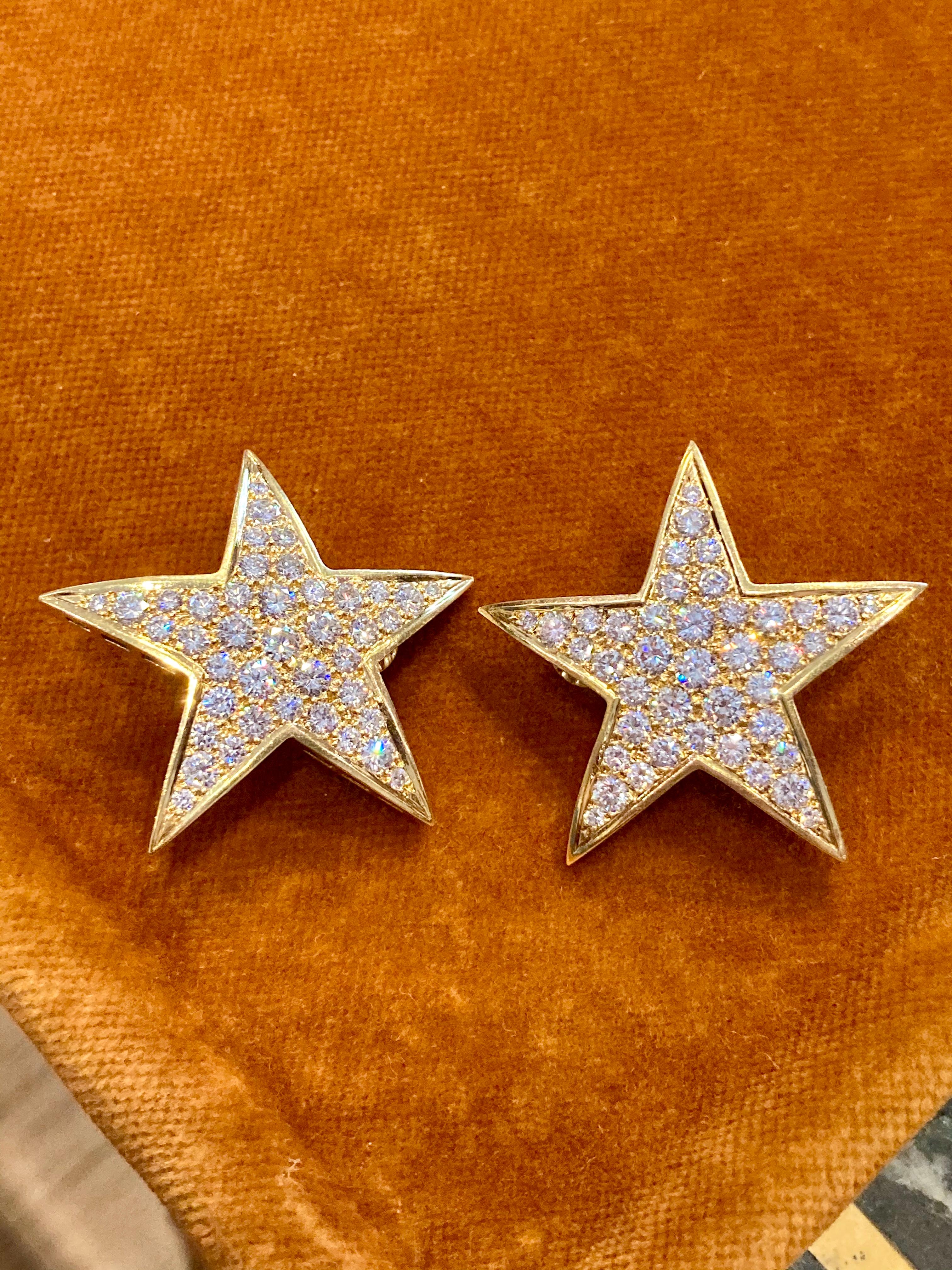 Stunning diamond star earclips circa 1970, featuring an open back that enhances the sparkle of the stones. Mounted in 18 karat yellow gold, with 5 carats of brilliant cut diamonds.