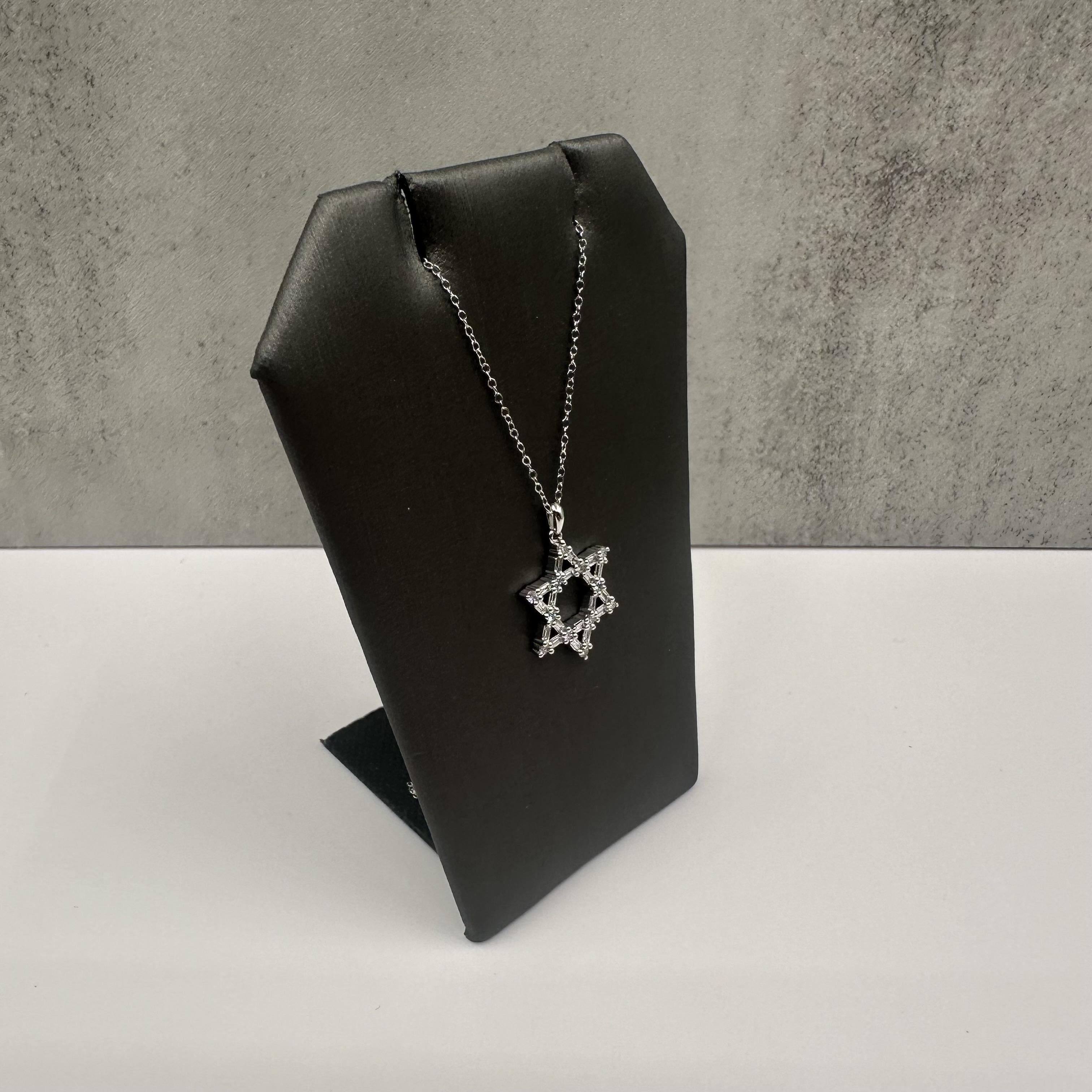 Celebrate faith and style with this beautiful Diamond Star of David Necklace, crafted in luminous 14kt White Gold. Featuring 0.33 carat total weight (ctw) of natural GH color and SI clarity diamonds, this elegant piece combines both baguette and