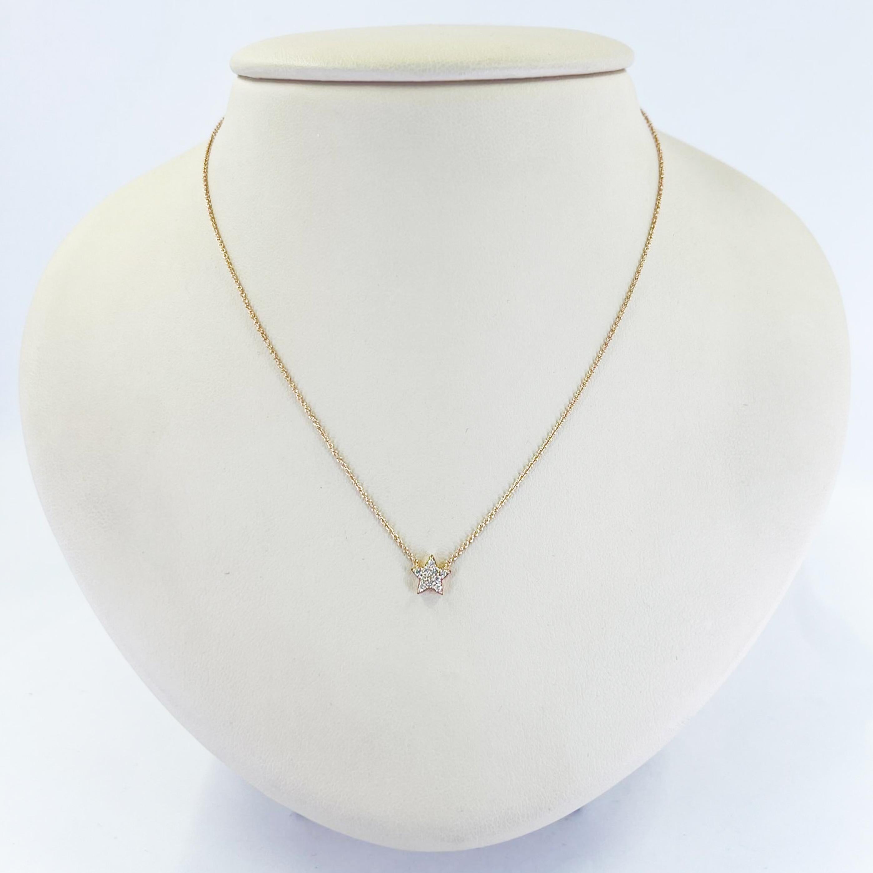 14 karat rose gold pave star pendant necklace featuring 11 round diamonds of VS clarity and H color totaling 0.11 carats. 16 inch chain with spring ring clasp. Finished weight is 1.5 grams.
