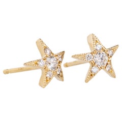 Orecchini a stella con diamante, oro