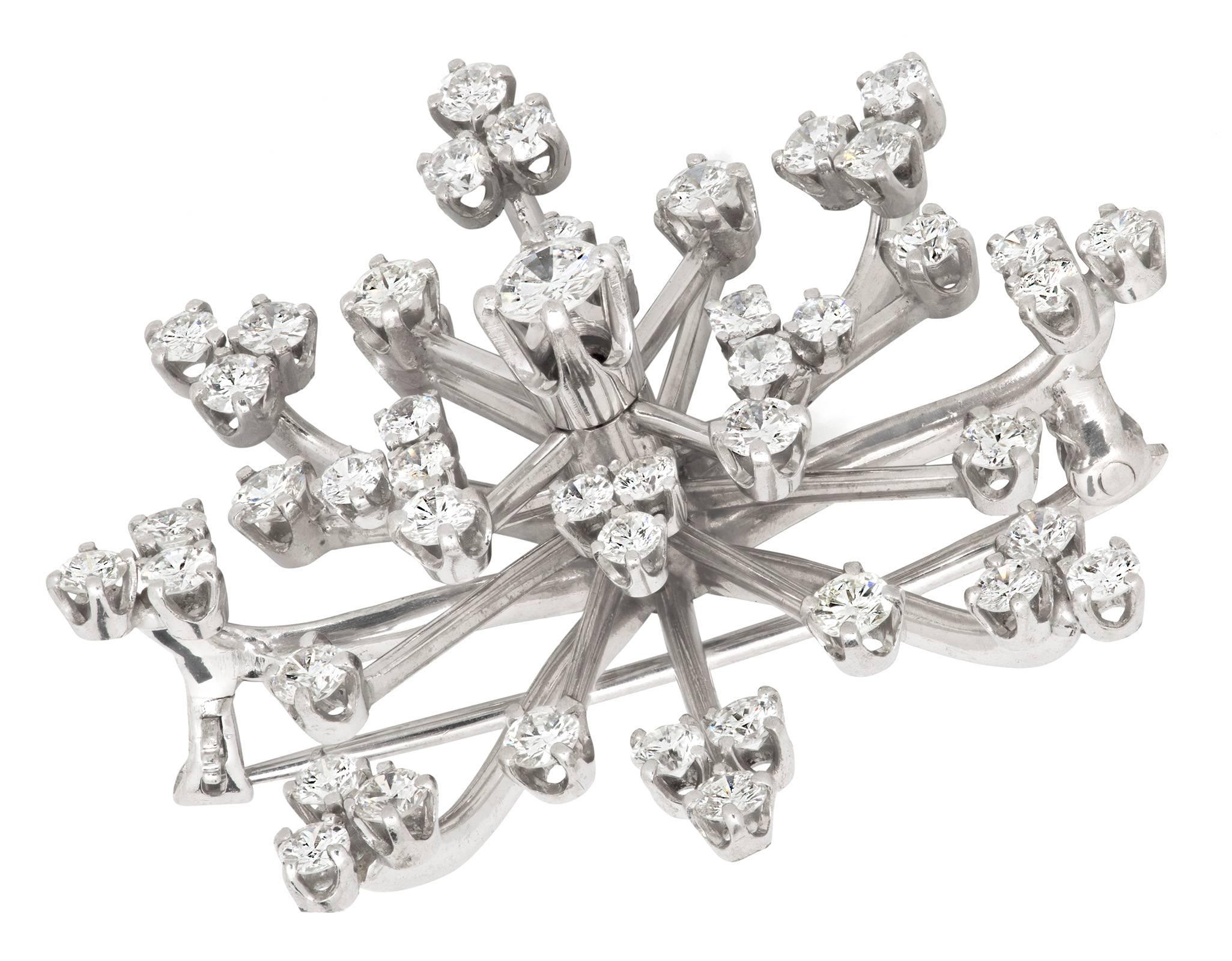 Diamonds on Platinum (tested) lovely brooch.  Burst of diamond star!   Delicate  but strong with platinum support.  Total diamond.  2.07ct. Si G-H. 
Back pin closure  is 14k.  
1.75w X 1.75h X .75d.   
Total weight 11.6g  