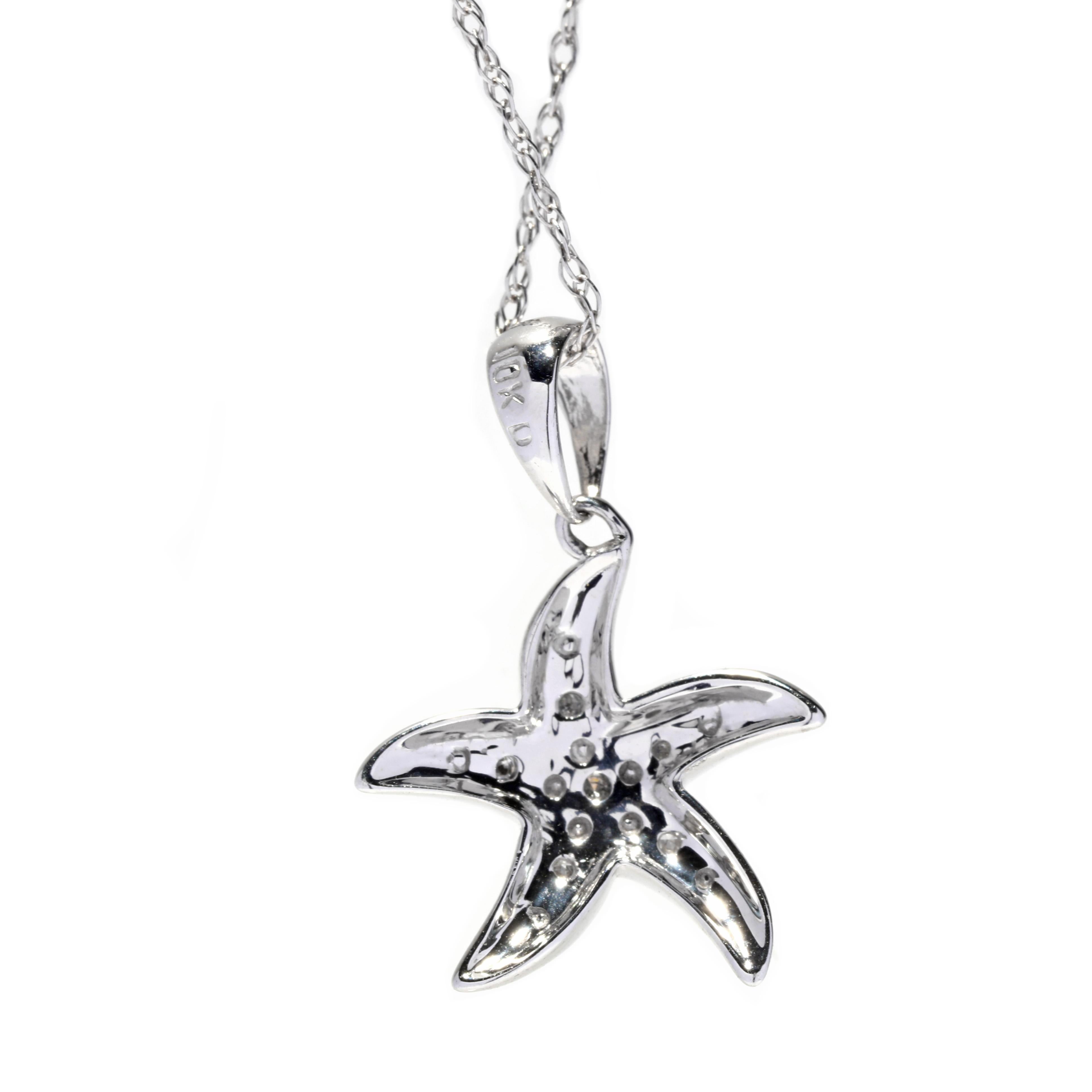 A vintage 10 karat white gold diamond starfish pendant necklace. This necklace features a starfish pendant set with single cut round diamonds weighing approximately .03 total carats suspended from a thin rope chain with a spring ring