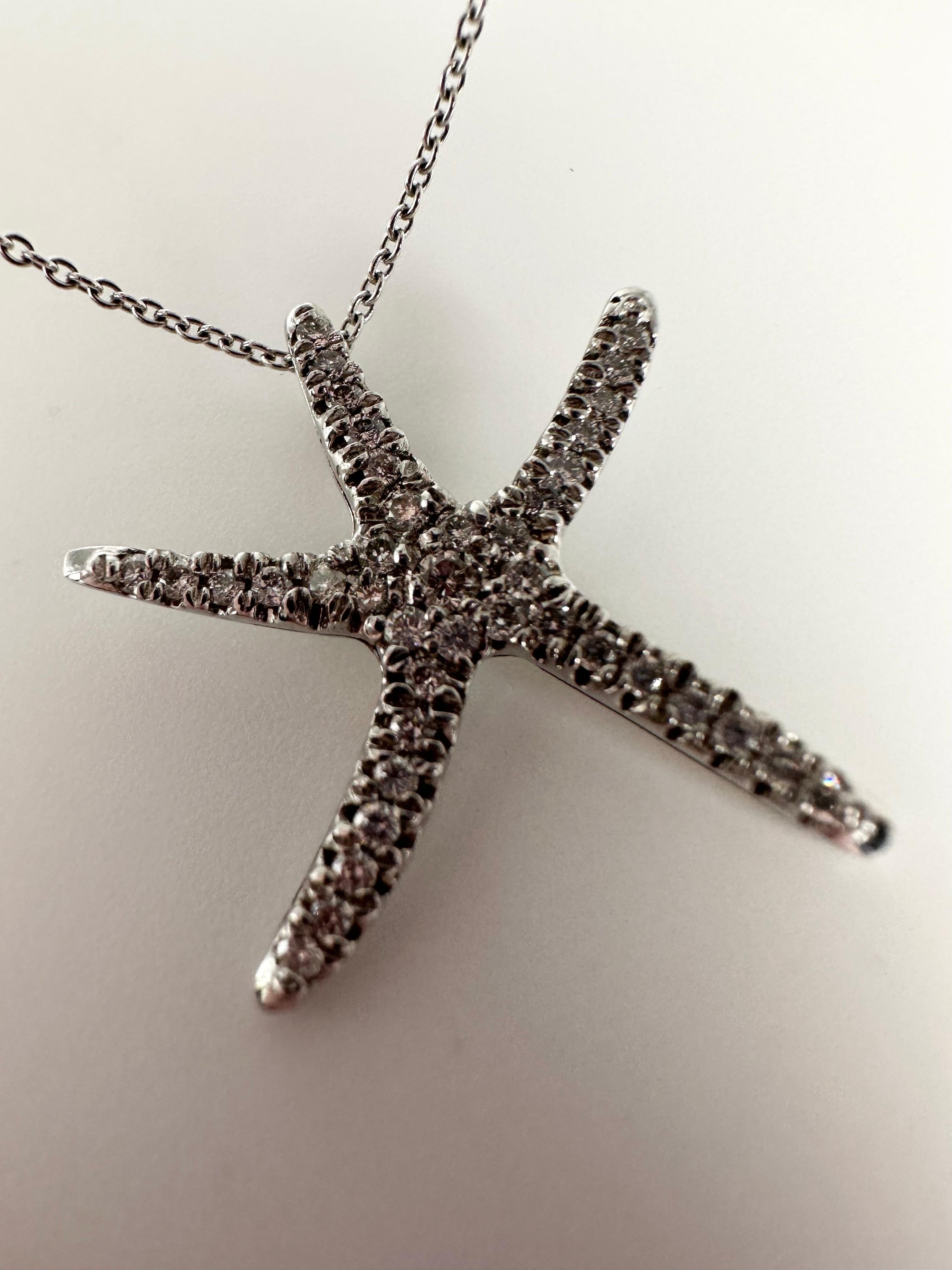 Cute startfish pendant necklace 16 inches long made with natural diamonds and 14KT solid white gold.

GOLD: 14KT gold/16