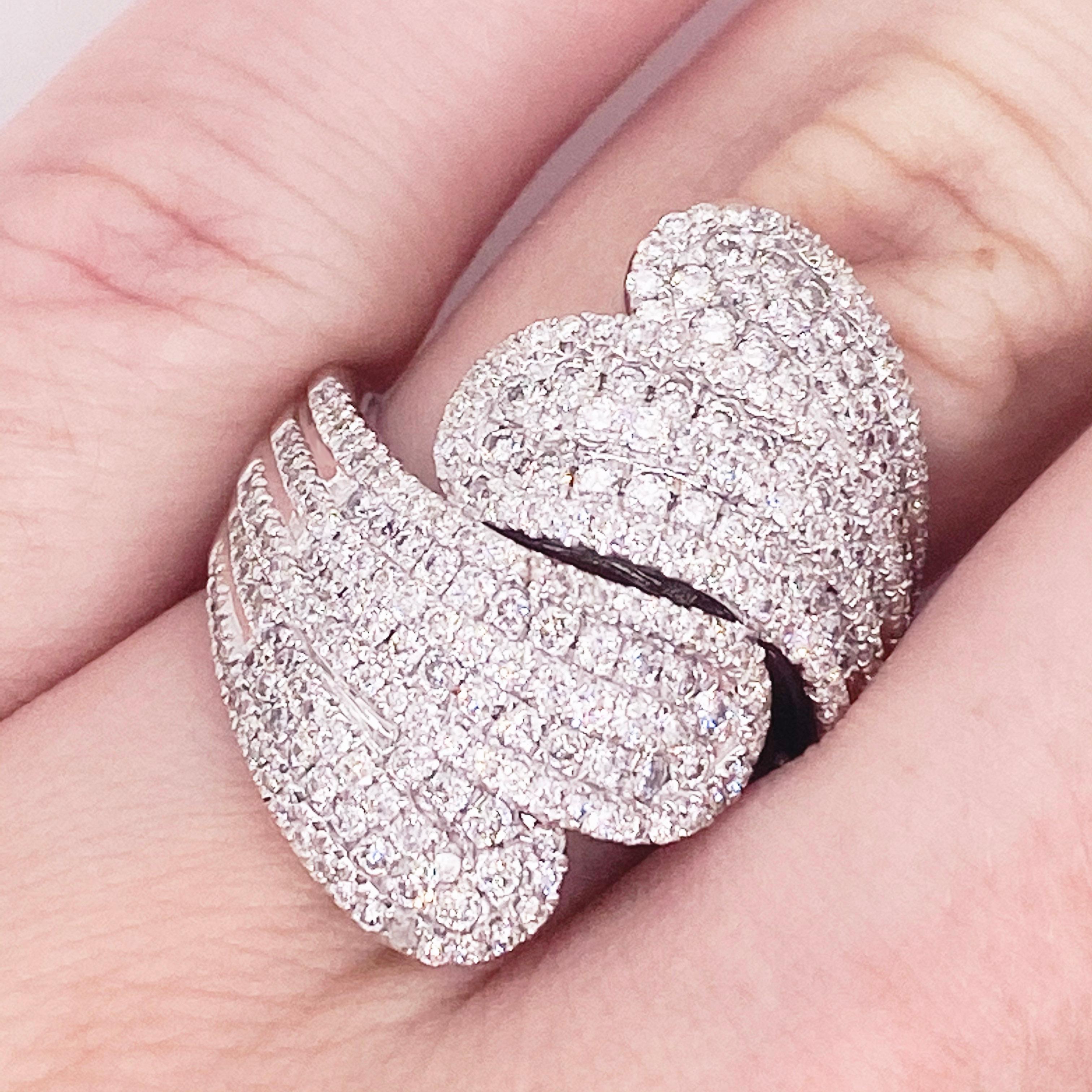 This stunning 14 Karat White Gold statement ring dripping with 1.79 Carats of diamonds is a showstopper! It is impossible not to feel glamorous with this gorgeous ring gracing your finger. This ring would make the perfect gift for your loved one or