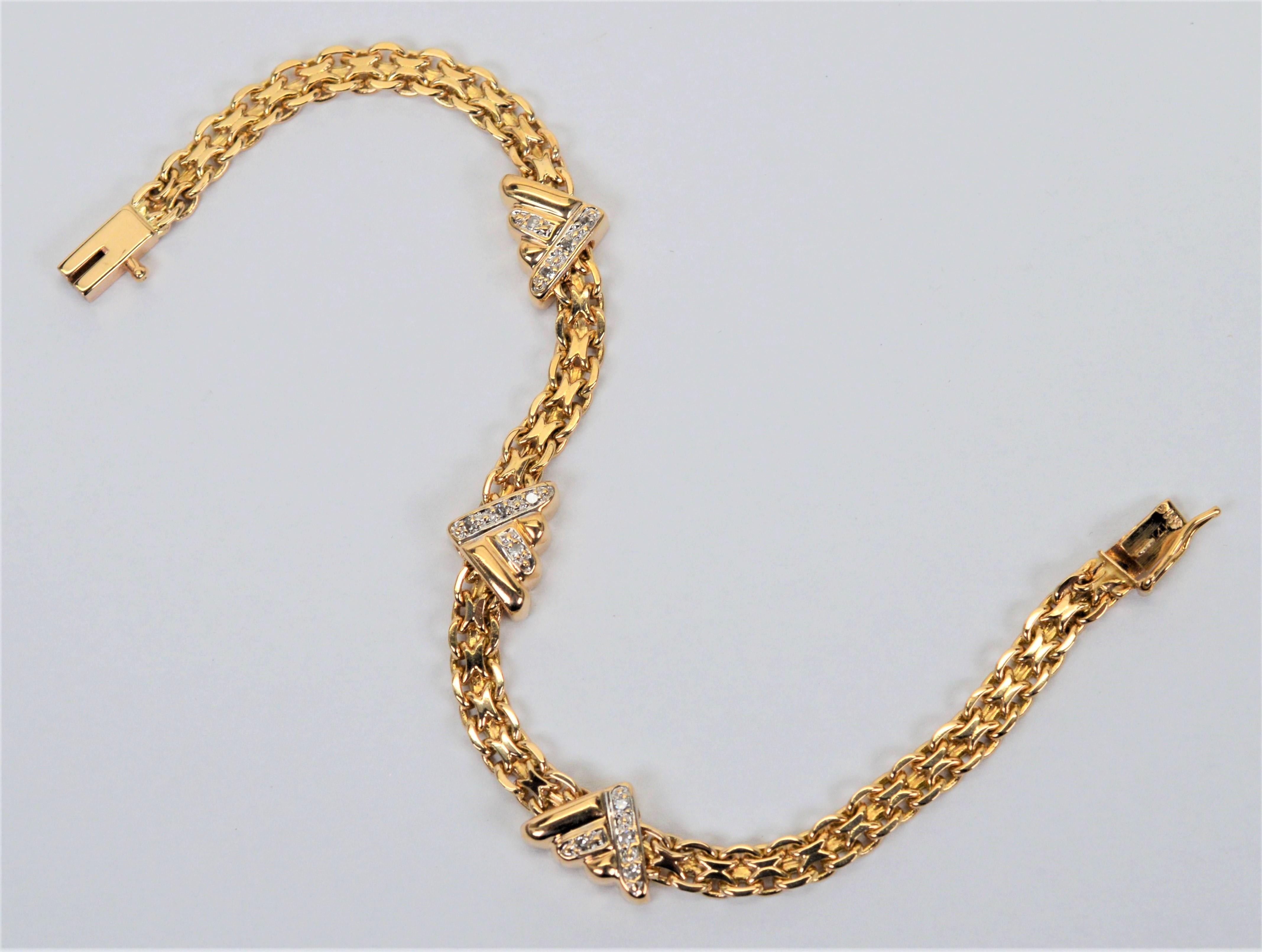 A unique mix of styles creates this ultra feminine wristlet. In fourteen karat yellow gold, its fancy 3.8mm wide Bismarck style chain bracelet resembles the profile of a slender tennis bracelet but in precious metal as it modestly presents three