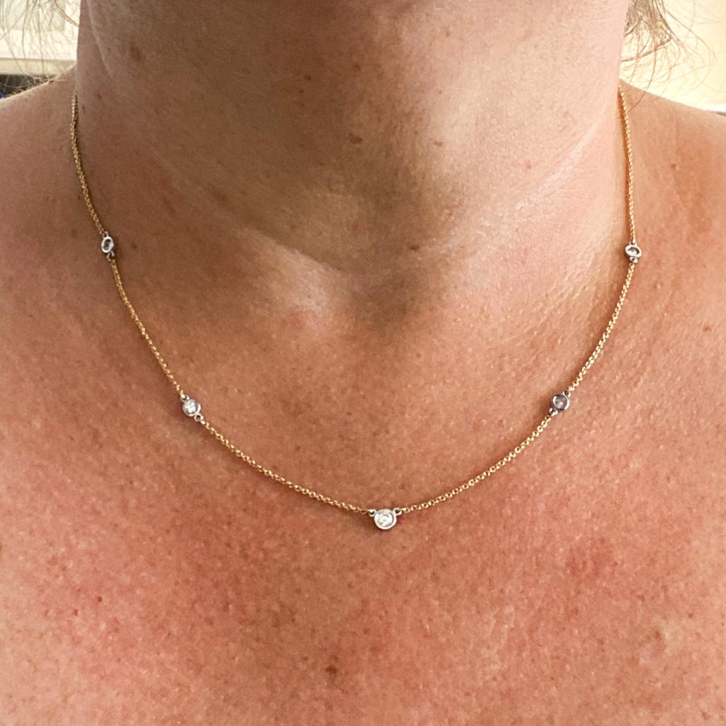Add a touch of elegance to your jewelry collection with this classic and versatile two-tone diamond station necklace. This sleek and stylish necklace is a perfect gift to mark a graduation, anniversary, birth, or important milestone! The white gold