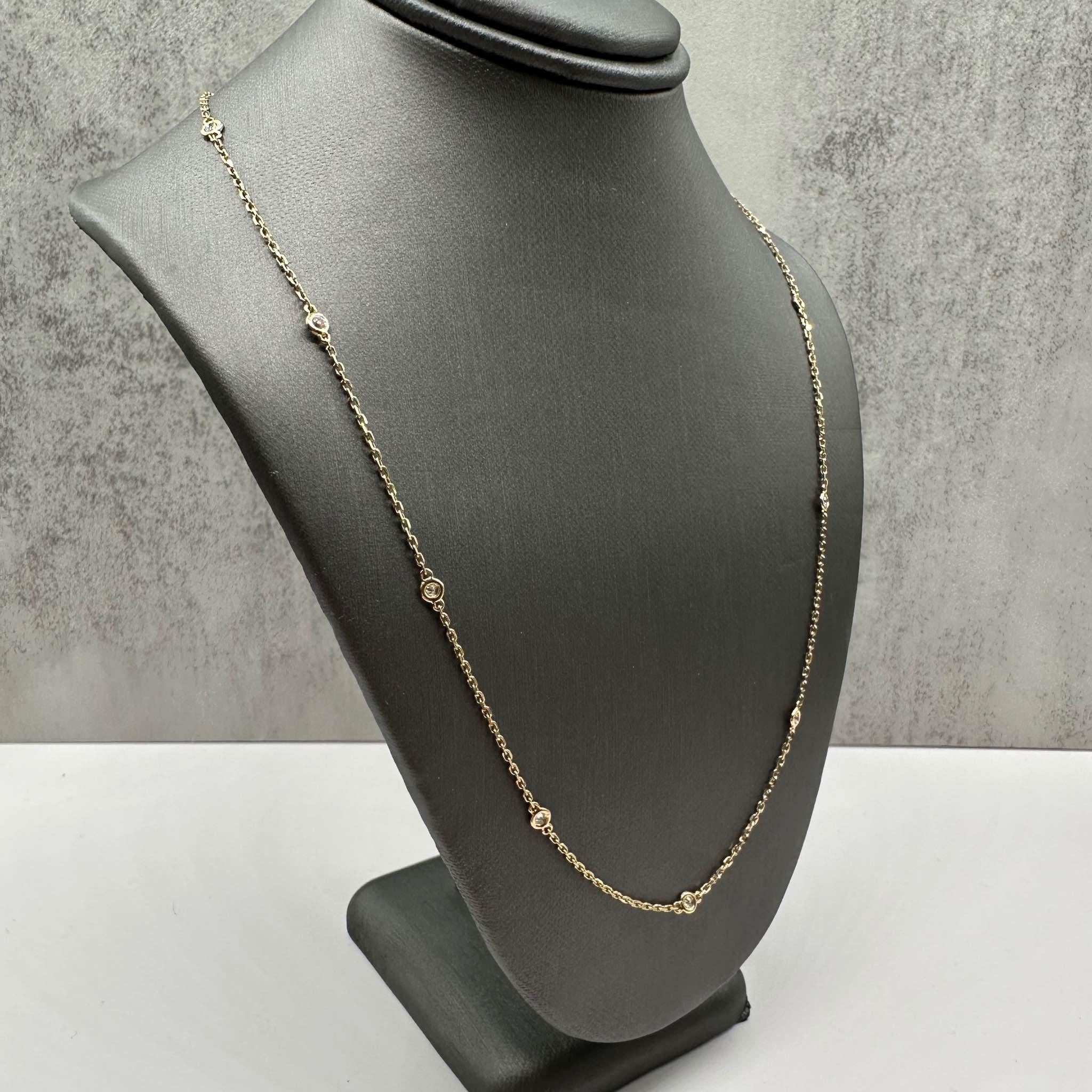 This elegant Diamond Station Necklace in 18kt yellow gold features 0.30ctw of natural GH SI round diamonds, set in 10 stations for a stunning, balanced look. The length is adjustable between 16 and 18 inches, offering versatility for different