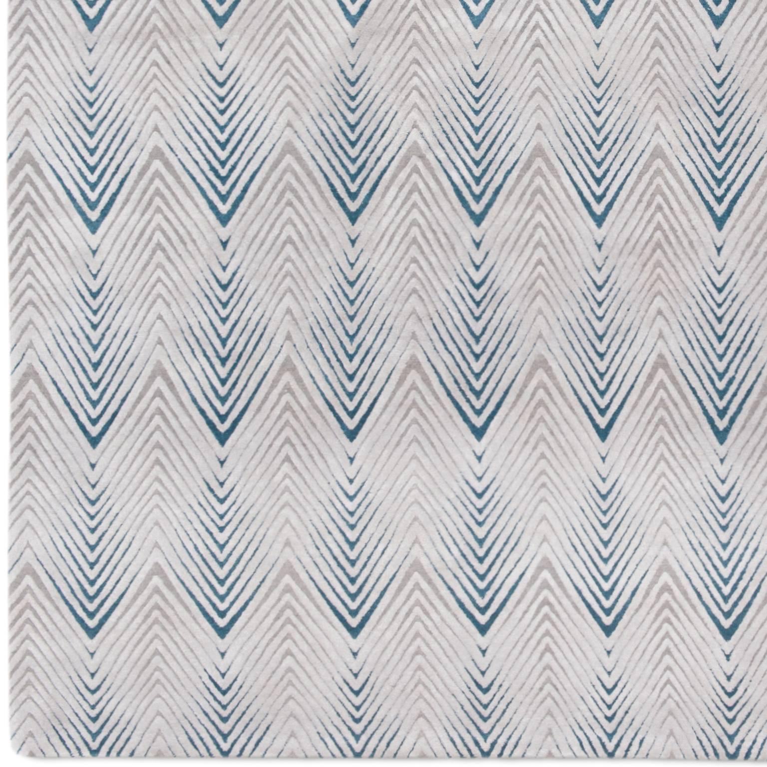 'Diamond Stripe' is from the Knots rugs new 2018 collection. This rug is produced in 150 knot quality in a high low pile. The chevron design is raised and in Chinese silk and the blush and soft mauve background is a lower pile in Tibetan wool. Also