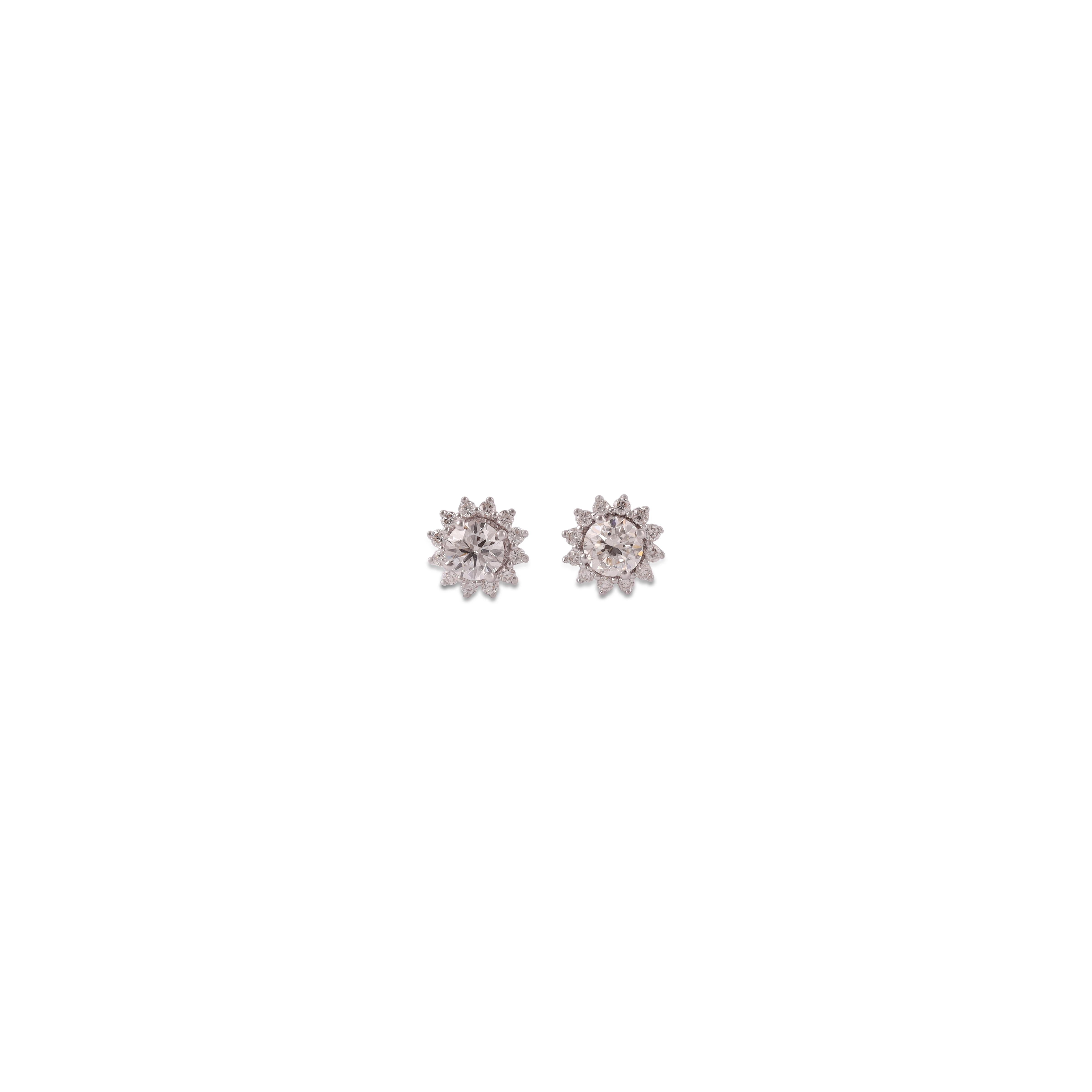 Diamond stud earrings weighing 0.50 Carats, in 18 Karat white Gold close  Setting.
Eye Clean, will not be able to tell on the Ear.
Great Pair for the Price too!
Gold - 1.86

More Diamond Studs Available