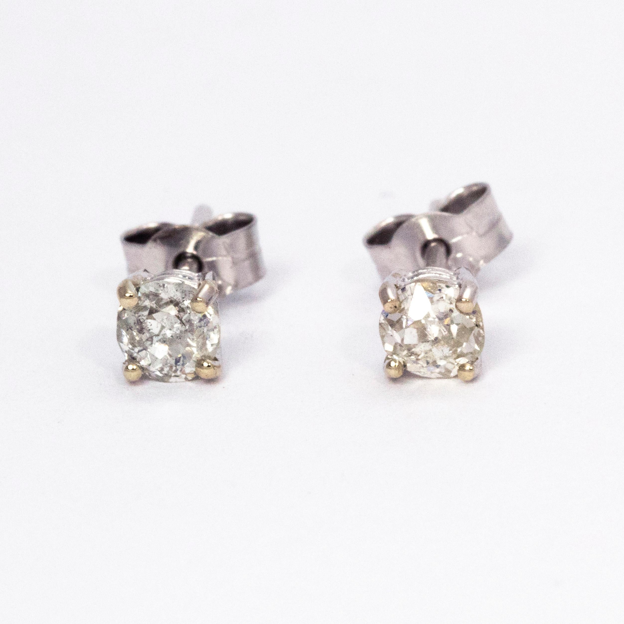 Beautifully simple diamond stud earrings holding 0.35 carat diamonds each set in 18ct white gold. 