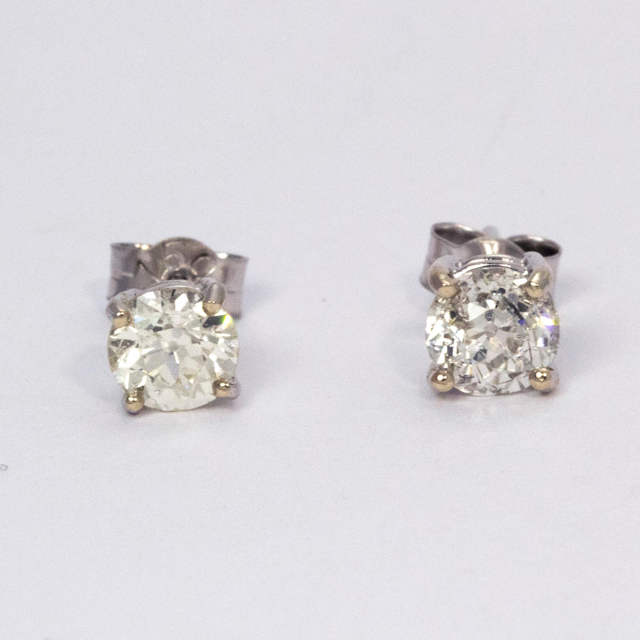 Sparkling earrings holding 0.66 and 0.68 carat diamonds set simply in 18ct white gold.