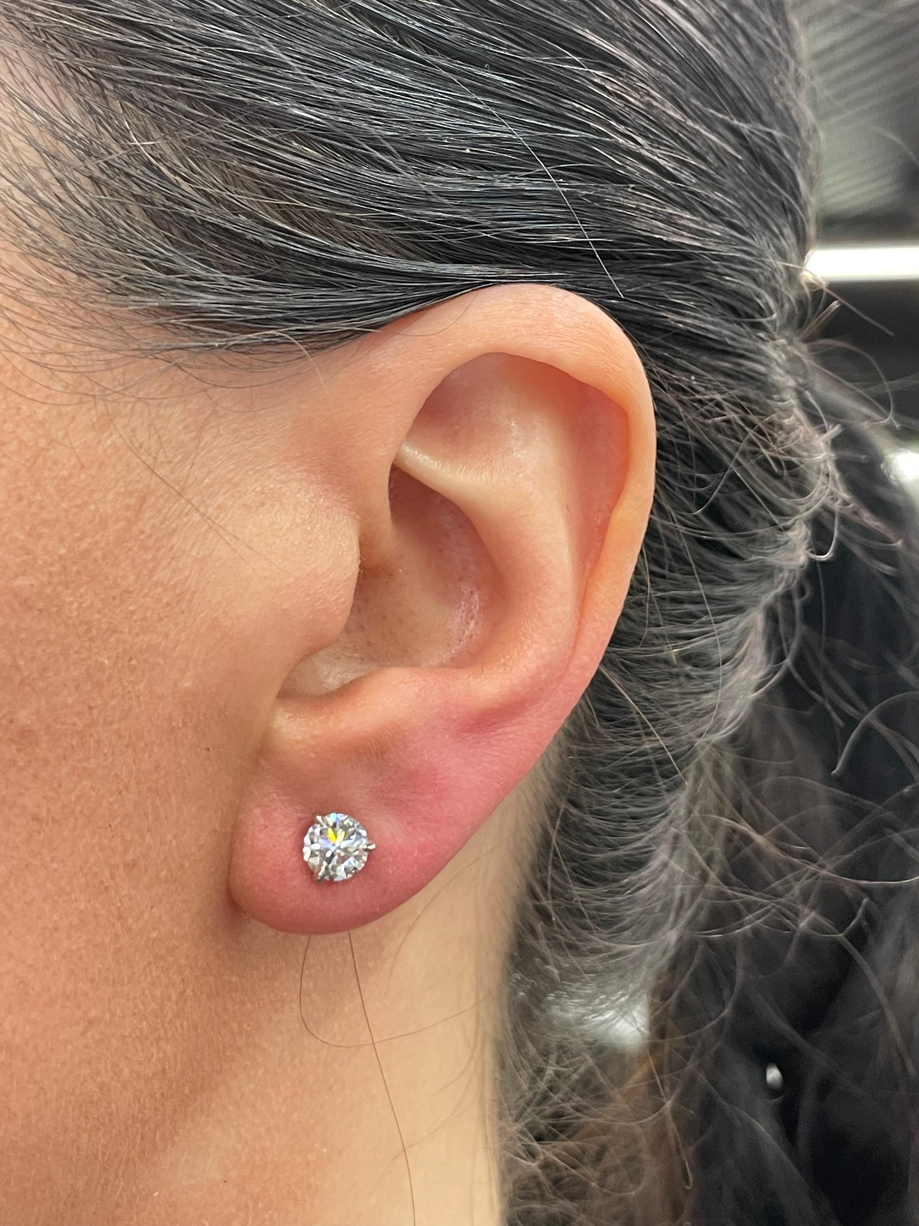 Diamond stud earrings weighing 1.40 carats in a three prong champagne setting, 18 karat white gold. 
Color I
Clarity SI3-I1

Setting can be changed to a Basket, Martini or Champagne/ 3 or 4 Prong/ 14 or 18 Karat.

DM for more Info & Videos on my