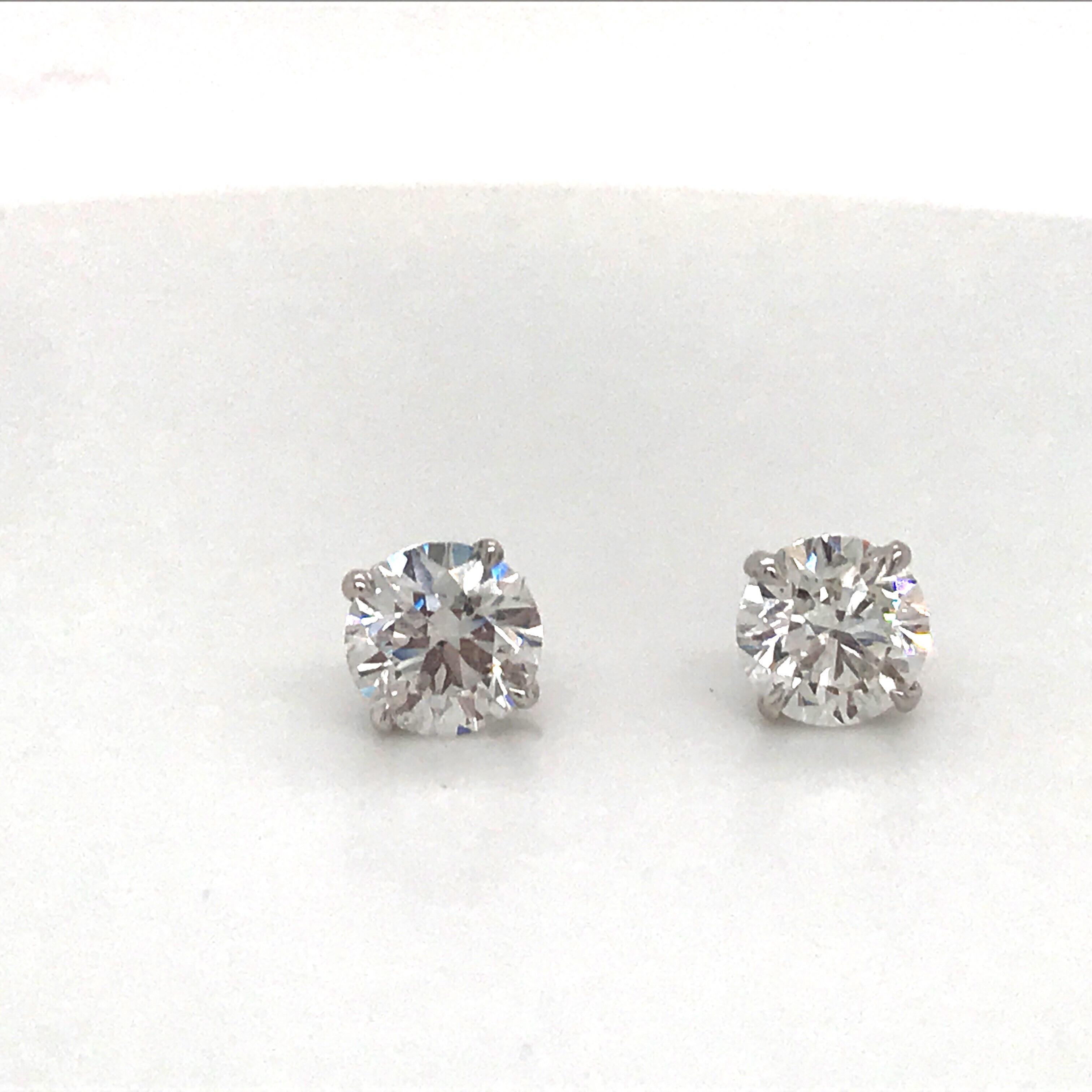 Diamond stud earrings weihging 1.40 carats in a 4 prong martini setting, 14k white gold
Color G-H
Clarity SI1
