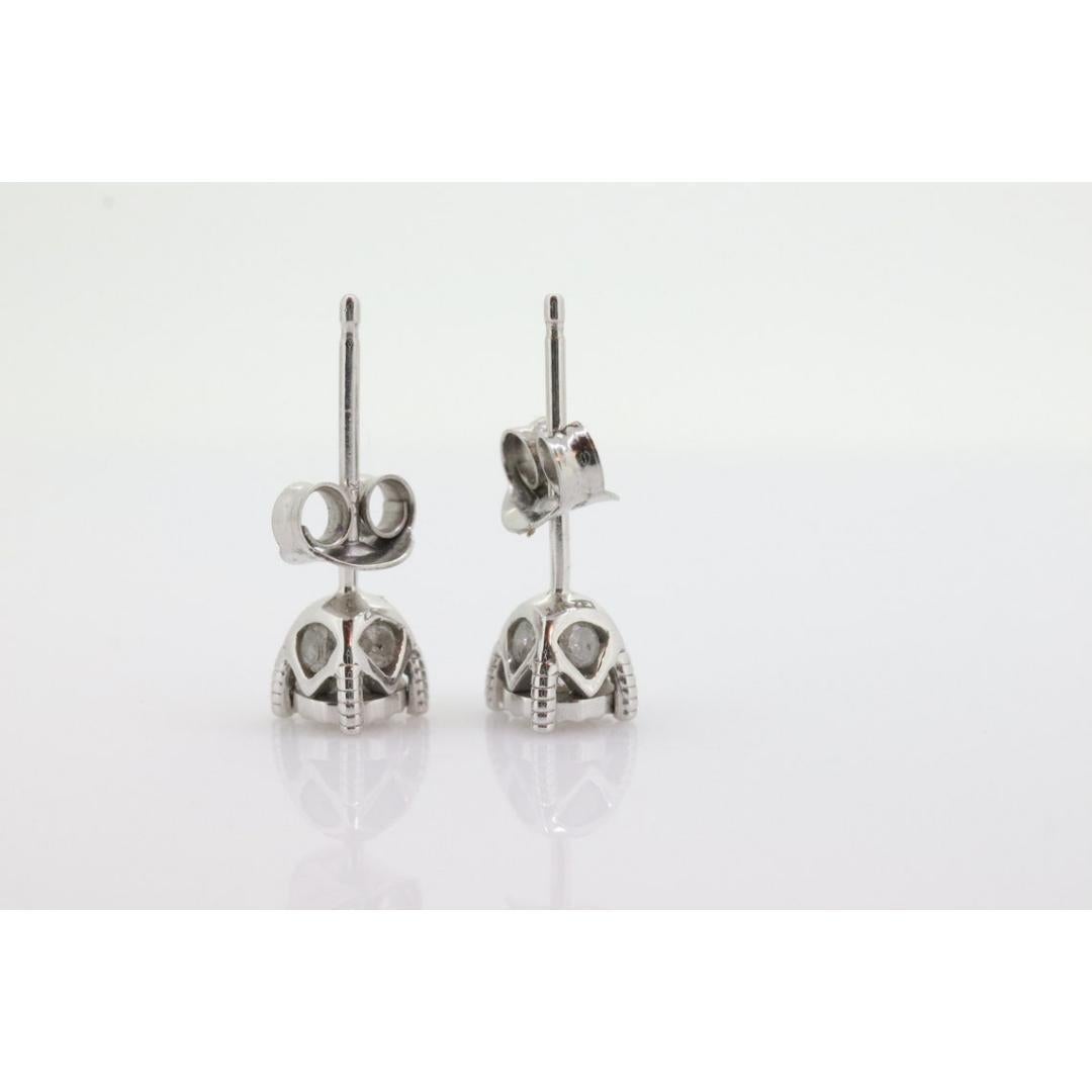 Women's Diamond stud earrings. 14k Diamond Solitaire earrings. Diamond encrusted earring For Sale
