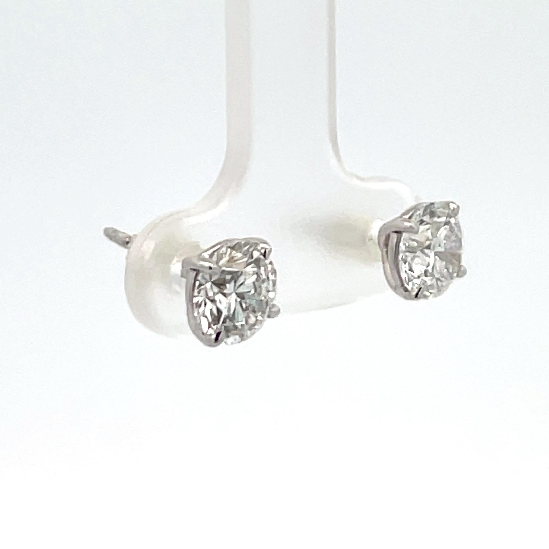 Contemporary Diamond Stud Earrings 2.01 Carats F SI2 18 Karat White Gold Champagne Setting
