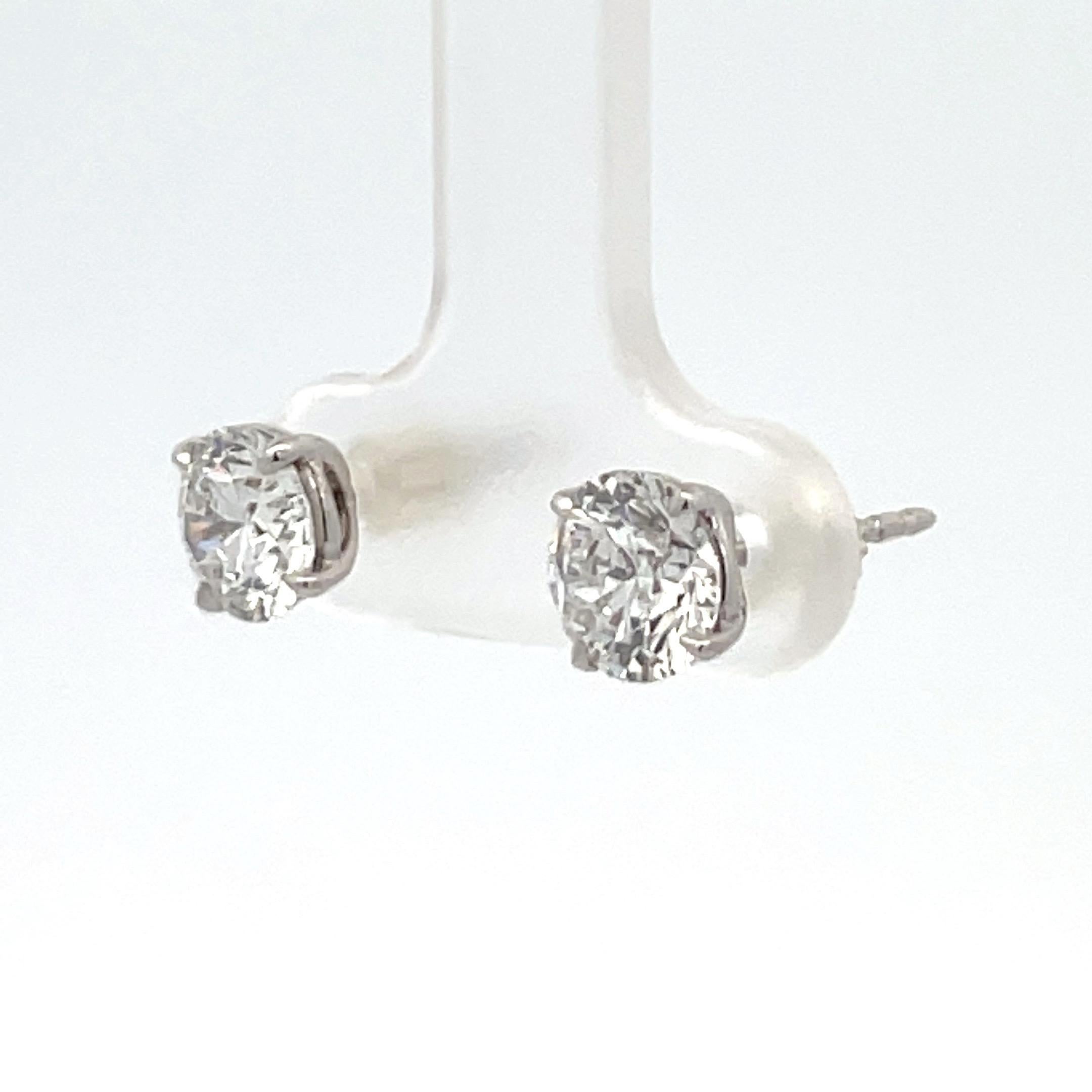 Round Cut Diamond Stud Earrings 2.01 Carats F SI2 18 Karat White Gold Champagne Setting