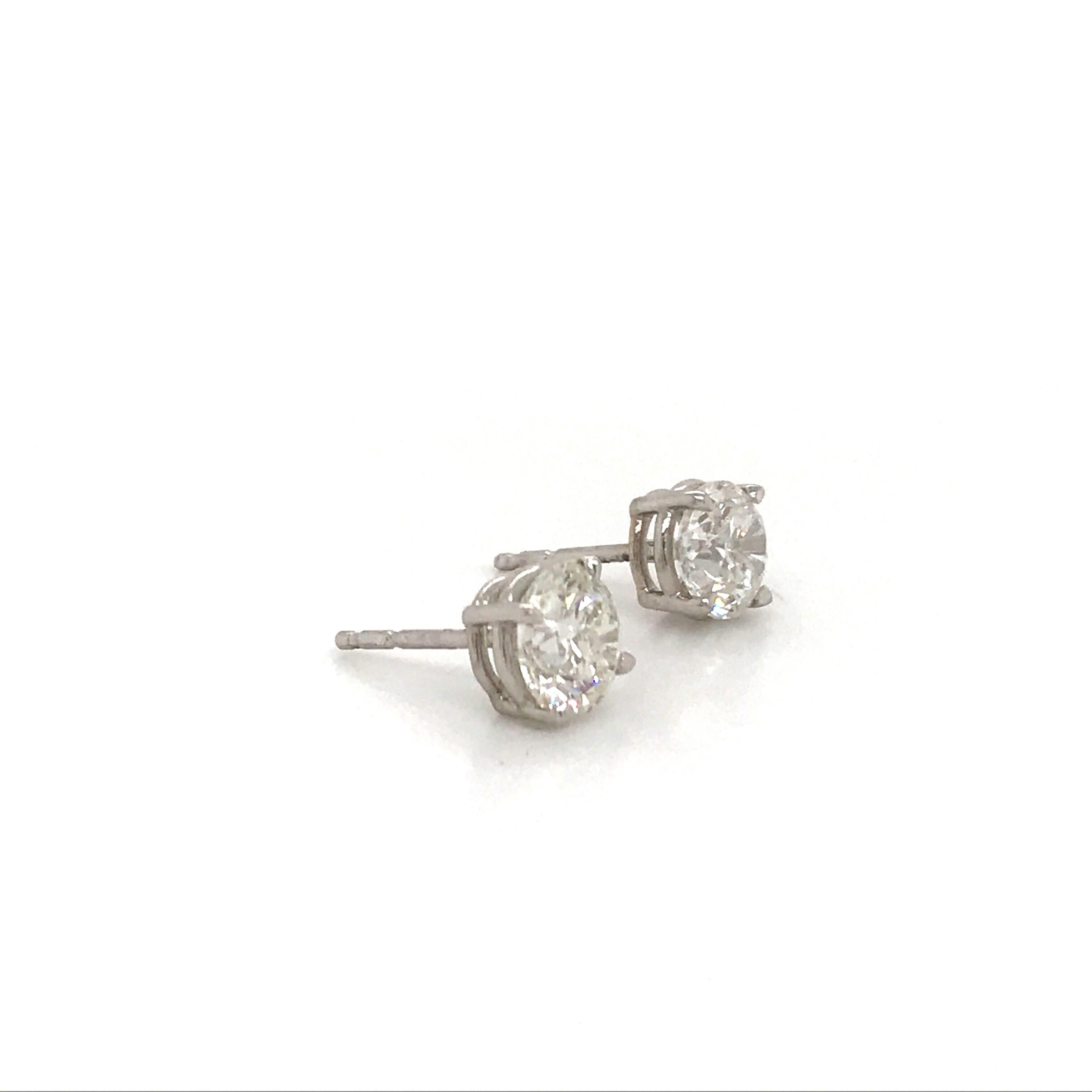 14K White gold diamond stud earrings weighing 2.02 carats in a 4 prong classic setting. 
Color G
Clarity I1-I2