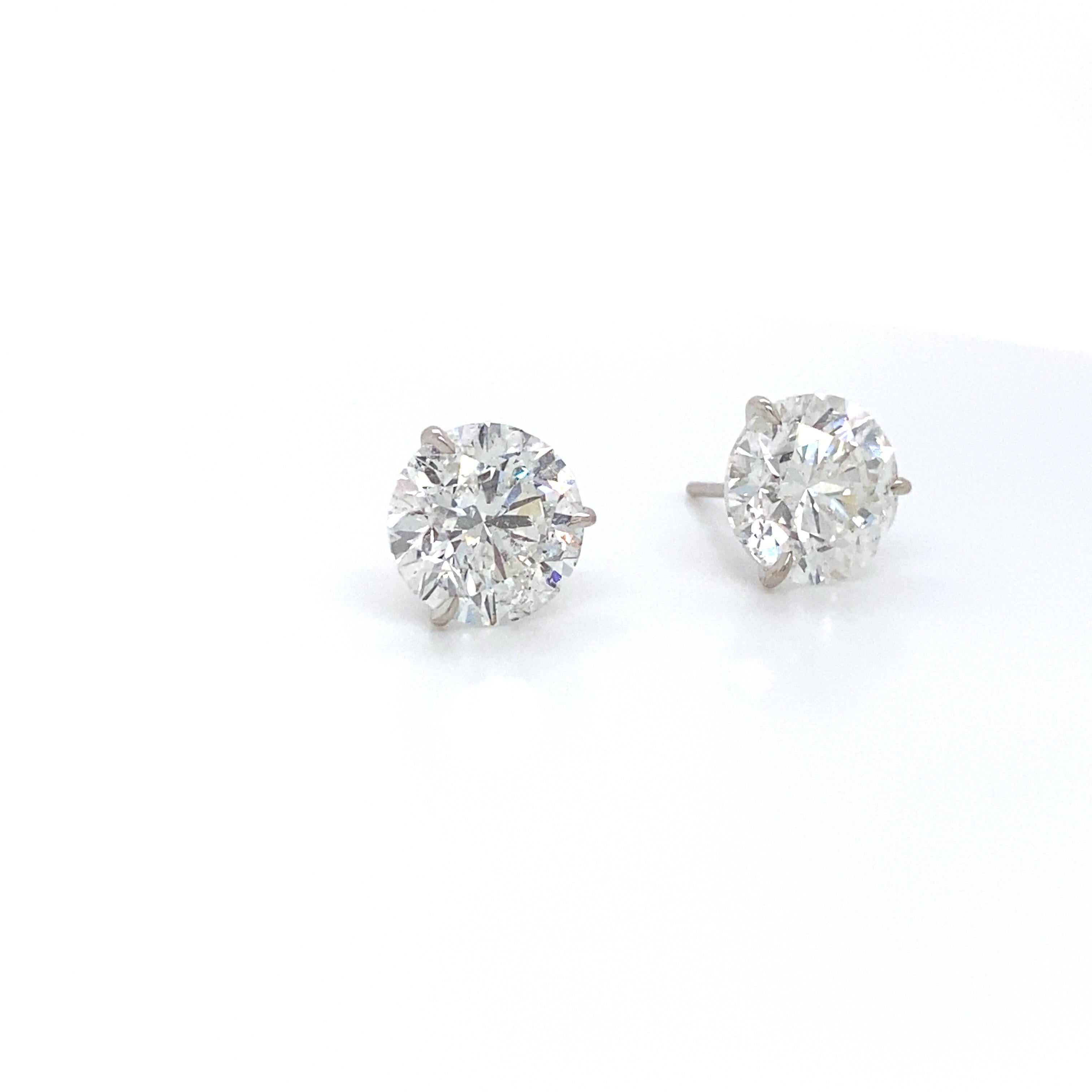 18K White gold diamond stud earrings weighing 2.84 carats in a 3 prong champagne setting.
Color H-I
Clarity SI2-I1

Very Brilliant Cut Stones. 
Eye Clean