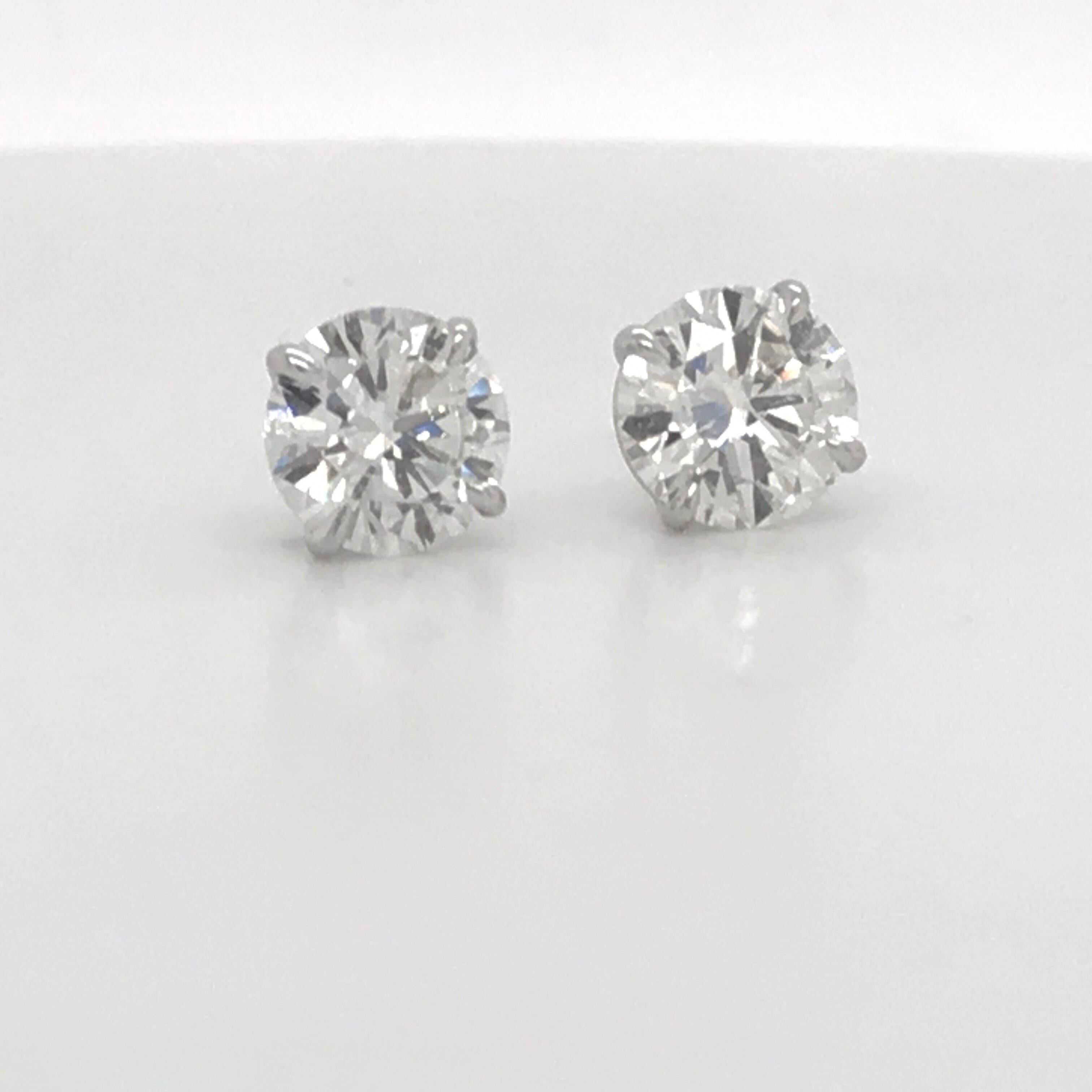 Diamond stud earrings weighing 3.05 Carats in 18K white g 4 prong champagne setting. 
Color H 
Clarity SI3-I1
