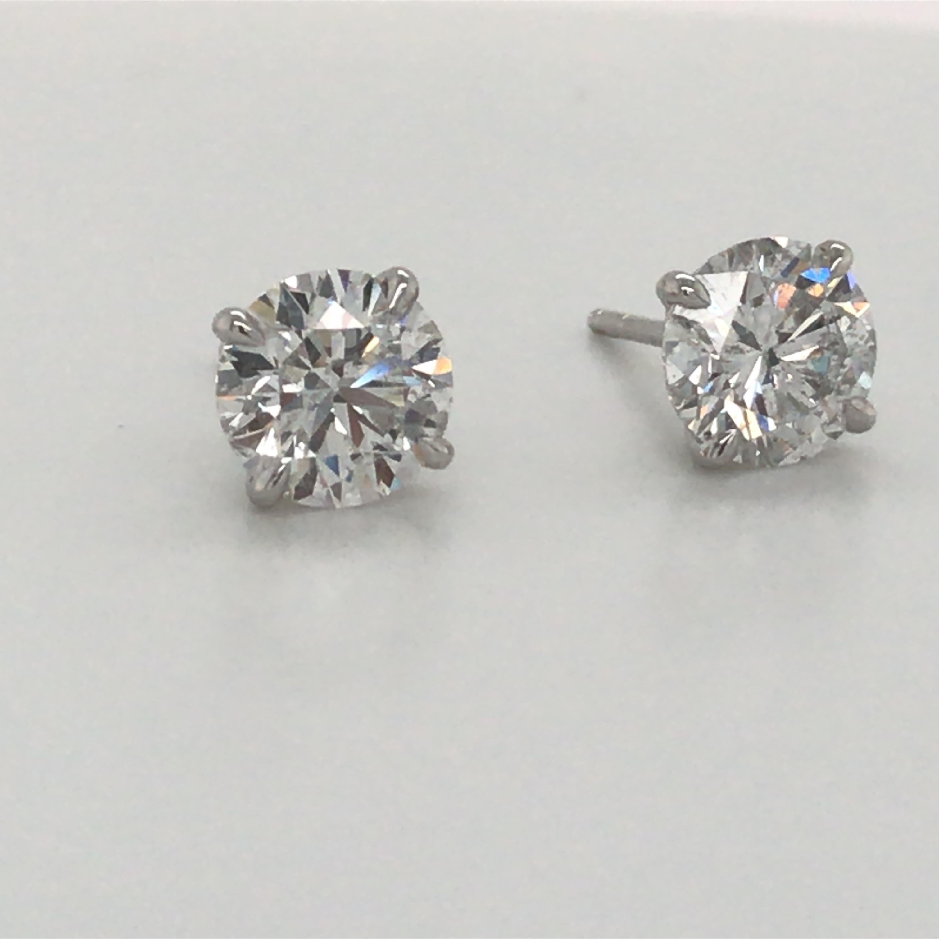 18K White gold diamond stud earrings weighing 3.06 carats in a 4 prong champagne setting. 
Color G-H
Clarity SI3-1

Brilliant Diamonds, Eye Clean

Please email for additional studs list. 