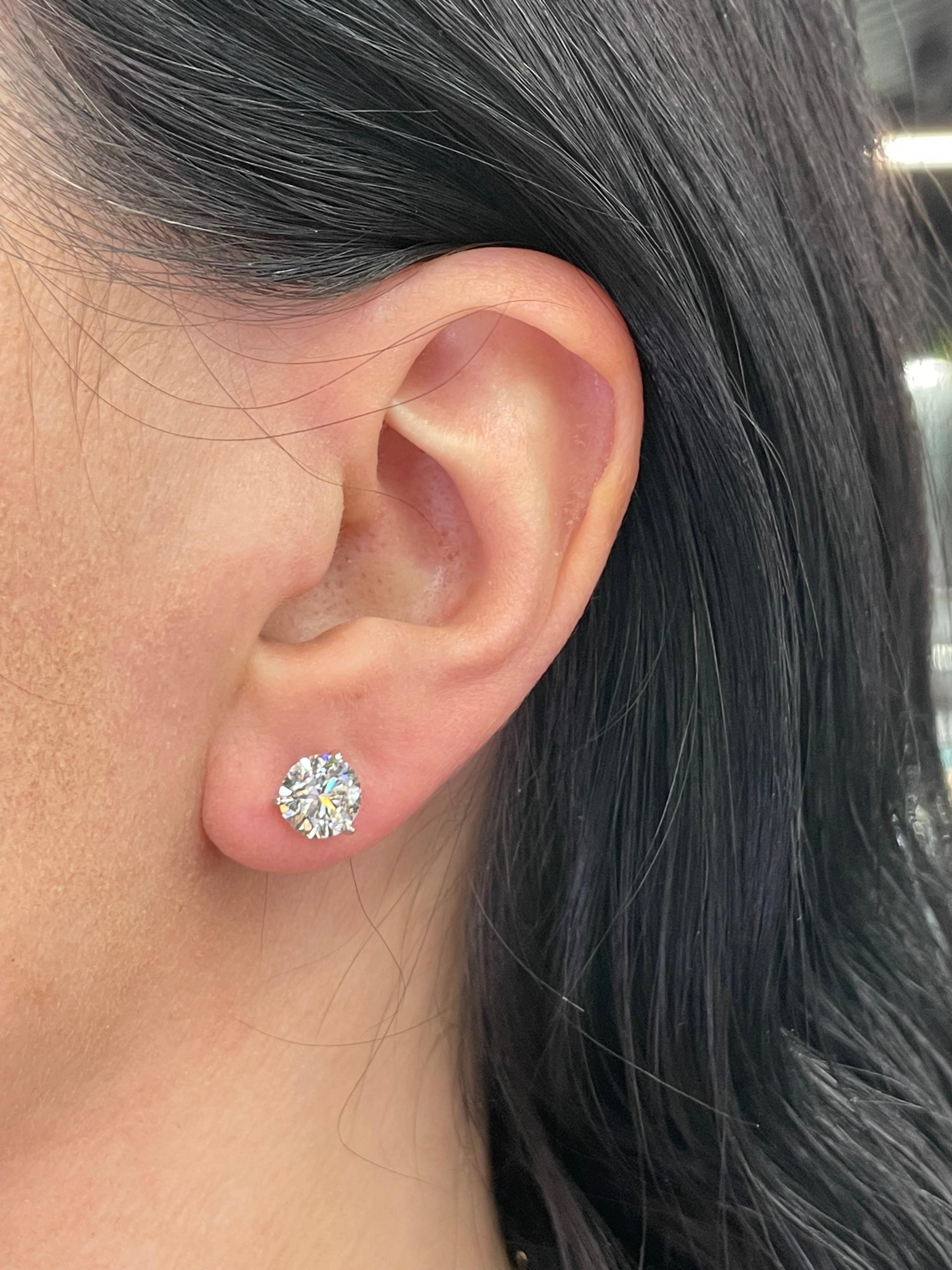 Diamond stud earrings weighing 3.09 Carats, Color J-K Clarity I1, in 18 Karat White Gold 3 prong Champagne setting. 
Nice Life & Clean to the Eye 
Setting can be changed to a Basket, Martini or Champagne/ 3 or 4 Prong/ 14 or 18 Karat.

DM for more