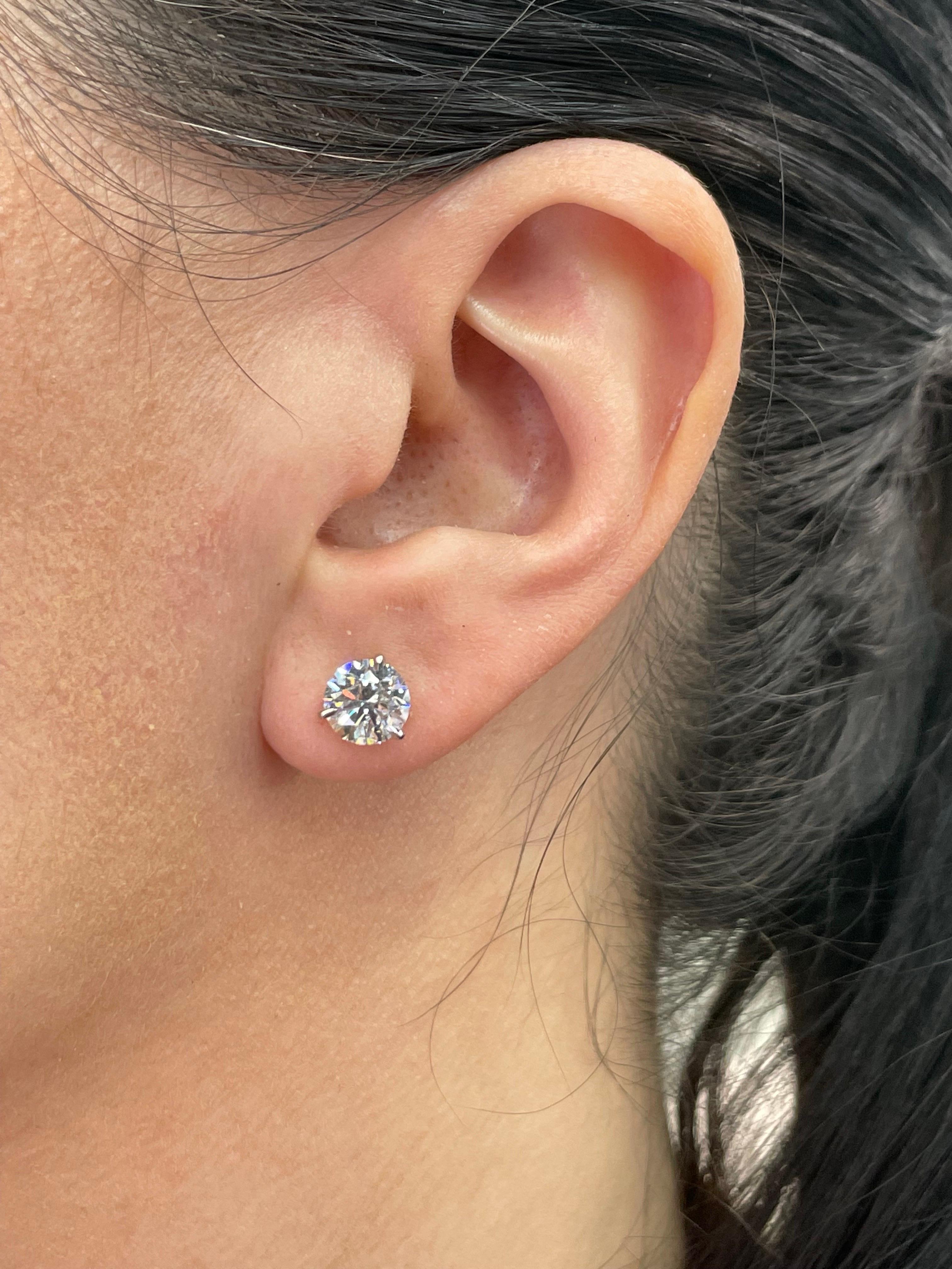 Diamond stud earrings weighing 3.15 Carats in a 3 prong Champagne setting, 18 Karat White Gold. 
Color G
Clarity SI2-3
Nice Color, Sparkle & Clean to the Eye

Diamonds are graded by our in house GIA Gemologist 
Call/Message us to discuss more in