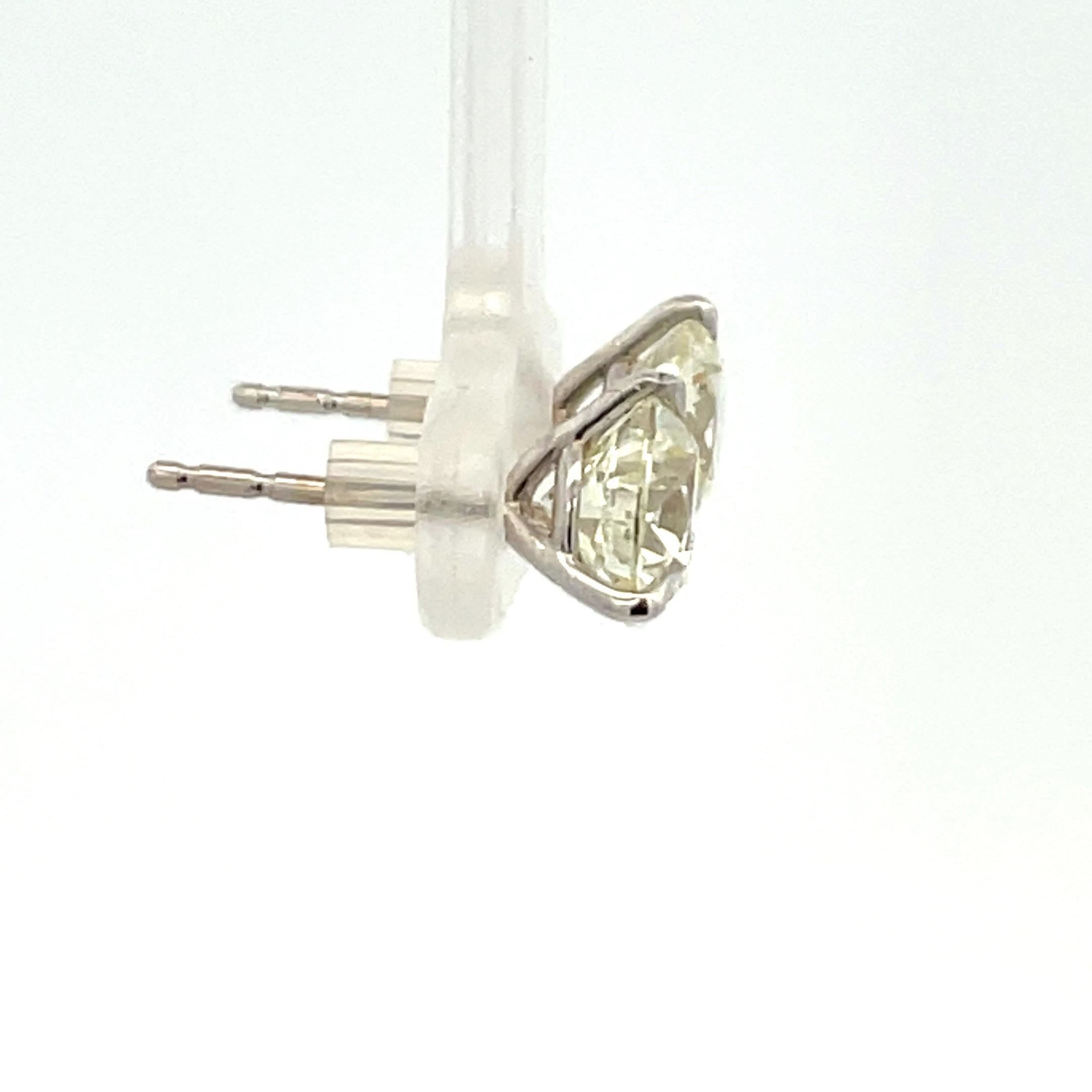 Diamond stud earrings weighing 3.20 Carats in a 3 prong Champagne setting, 18 Karat White Gold.
Color K-L
Clarity SI1-2

Comments: FULL of Life, Eye Clean, Does not look yellow - faces up better than K-L

Setting can be changed to a Basket, Martini