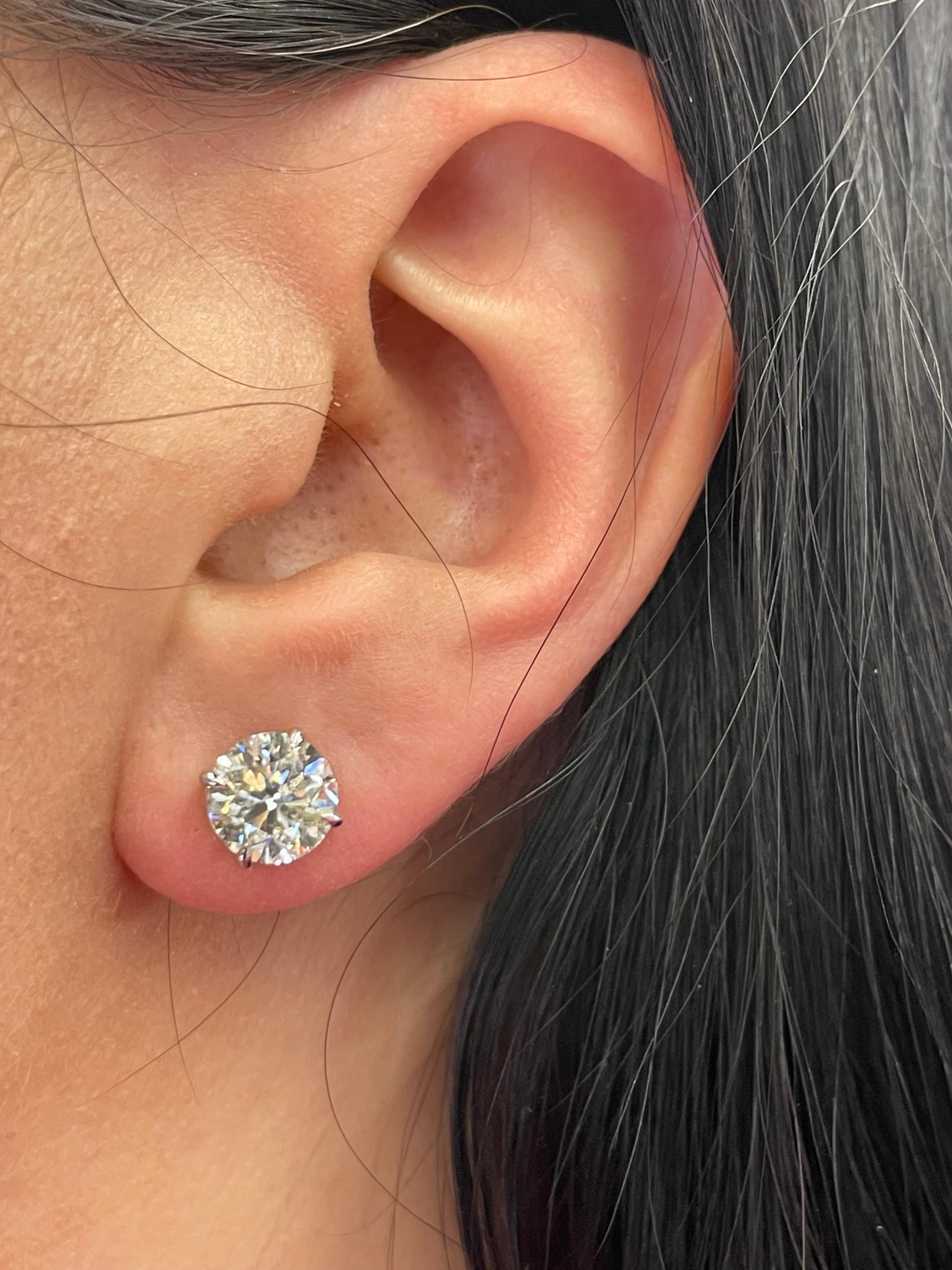 Diamond stud earrings weighing 4.04 Carats, Color J, Clarity I1, in 14 Karat White Gold 4 prong Basket setting. 
Face up Whiter than J, 7/10 Life 
Setting can be changed to a Basket, Martini or Champagne/ 3 or 4 Prong/ 14 or 18 Karat.

These