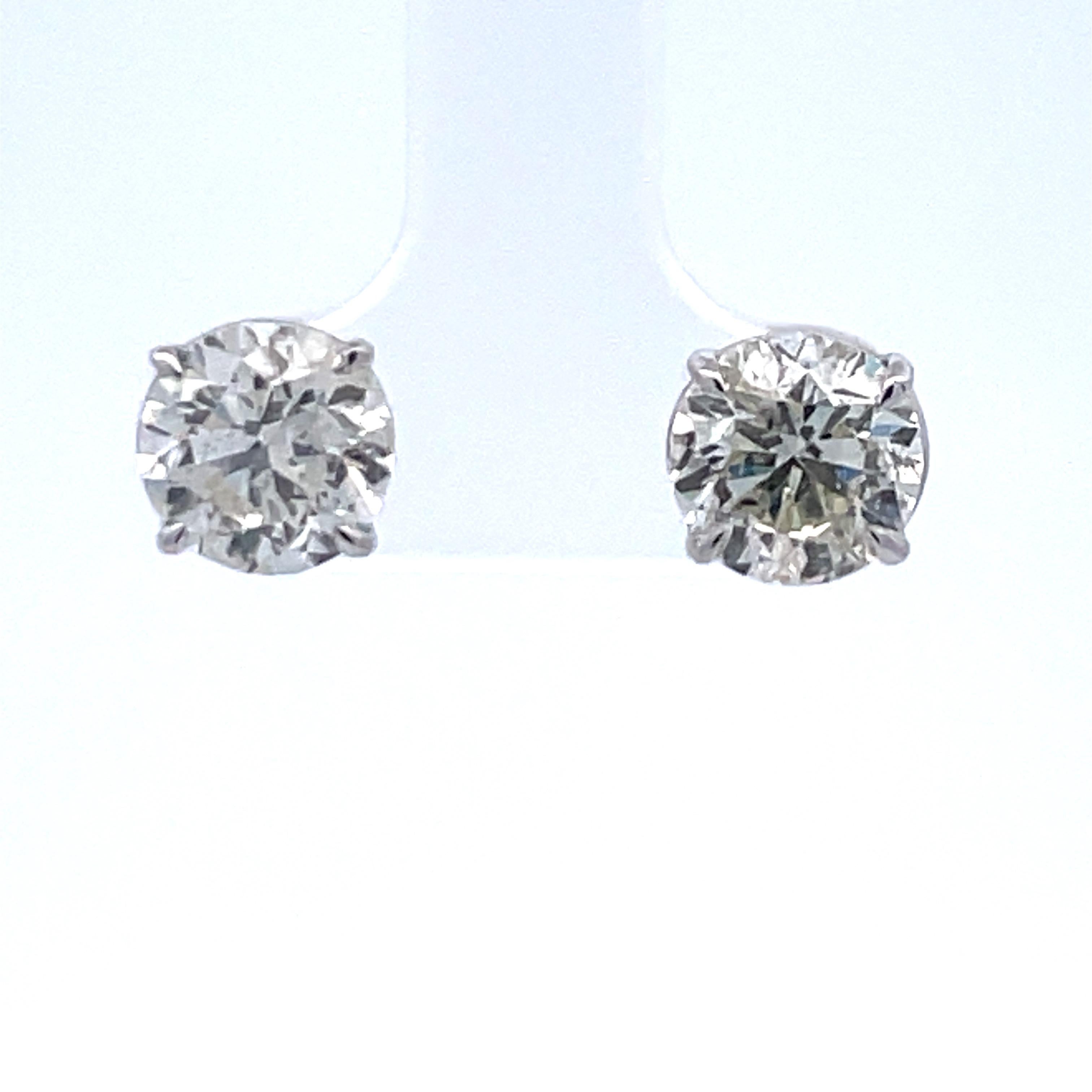 1.5 carat diamond earrings on ear