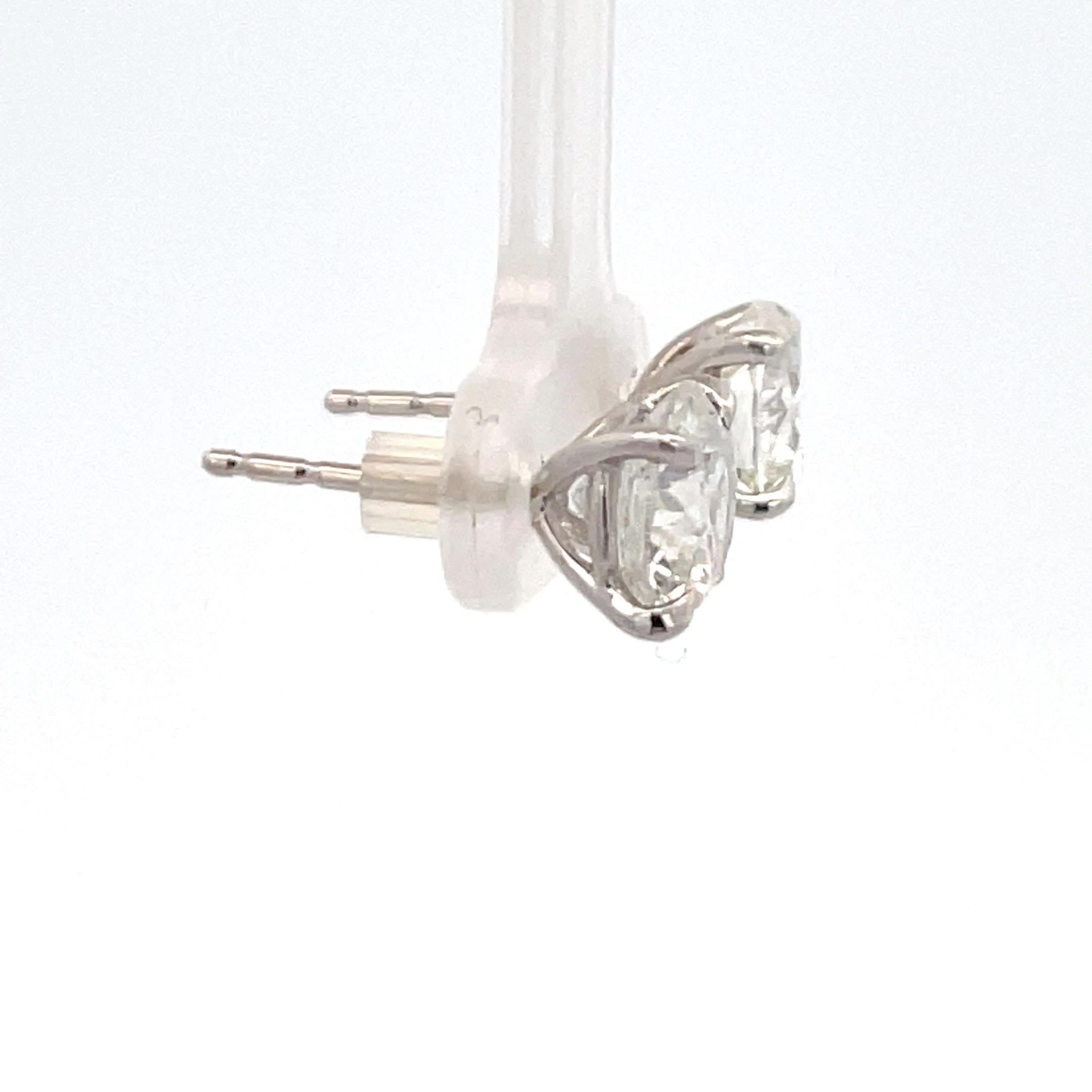 Diamond stud earrings weighing 4.06 Carats, Color G-H, Clarity I1-I2, in 18 Karat White Gold 4 prong Champagne setting. 
Nice Color, Clean to Eye 8/10, Nice Life
Setting can be changed to a Basket, Martini or Champagne/ 3 or 4 Prong/ 14 or 18
