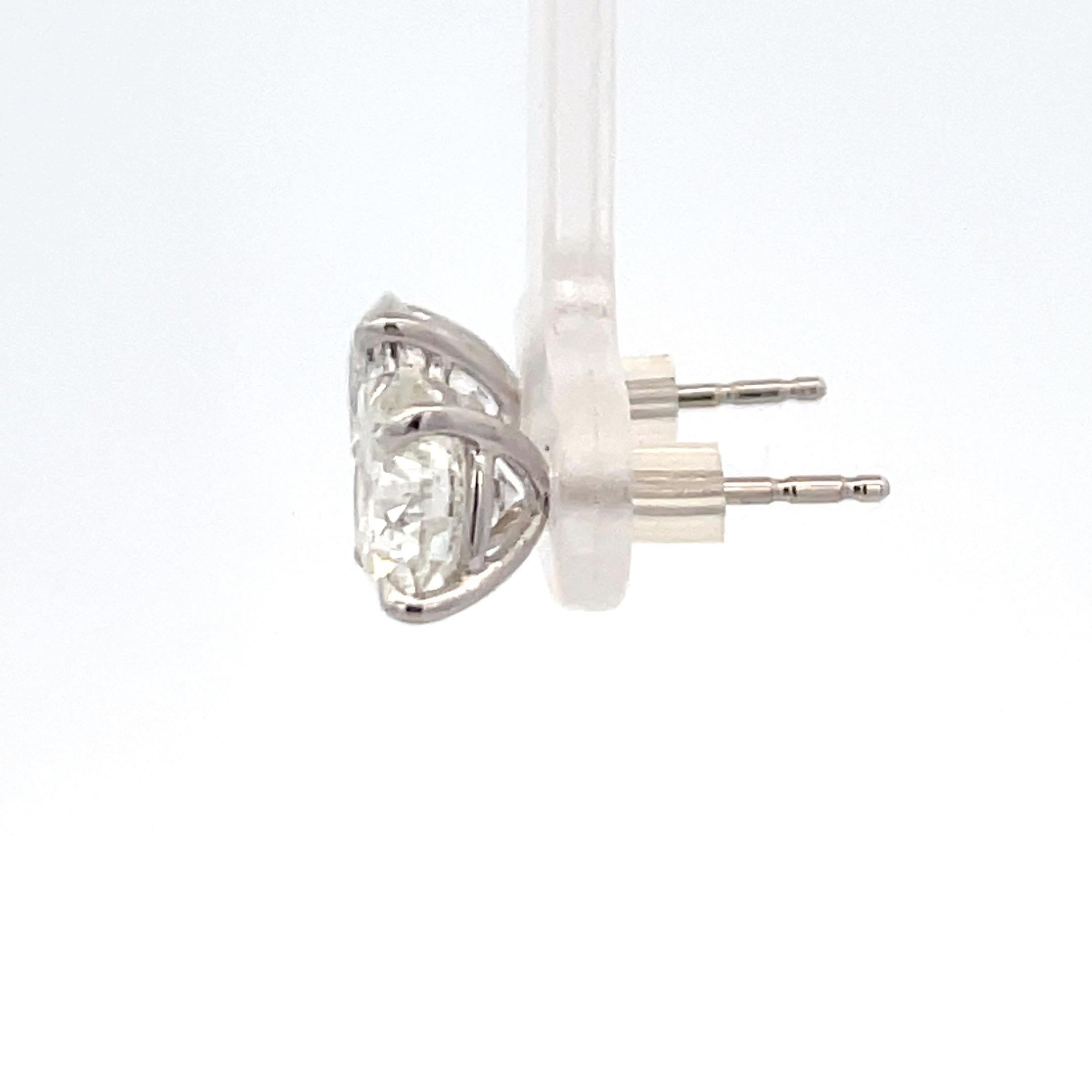 4 carat diamond earrings on ear