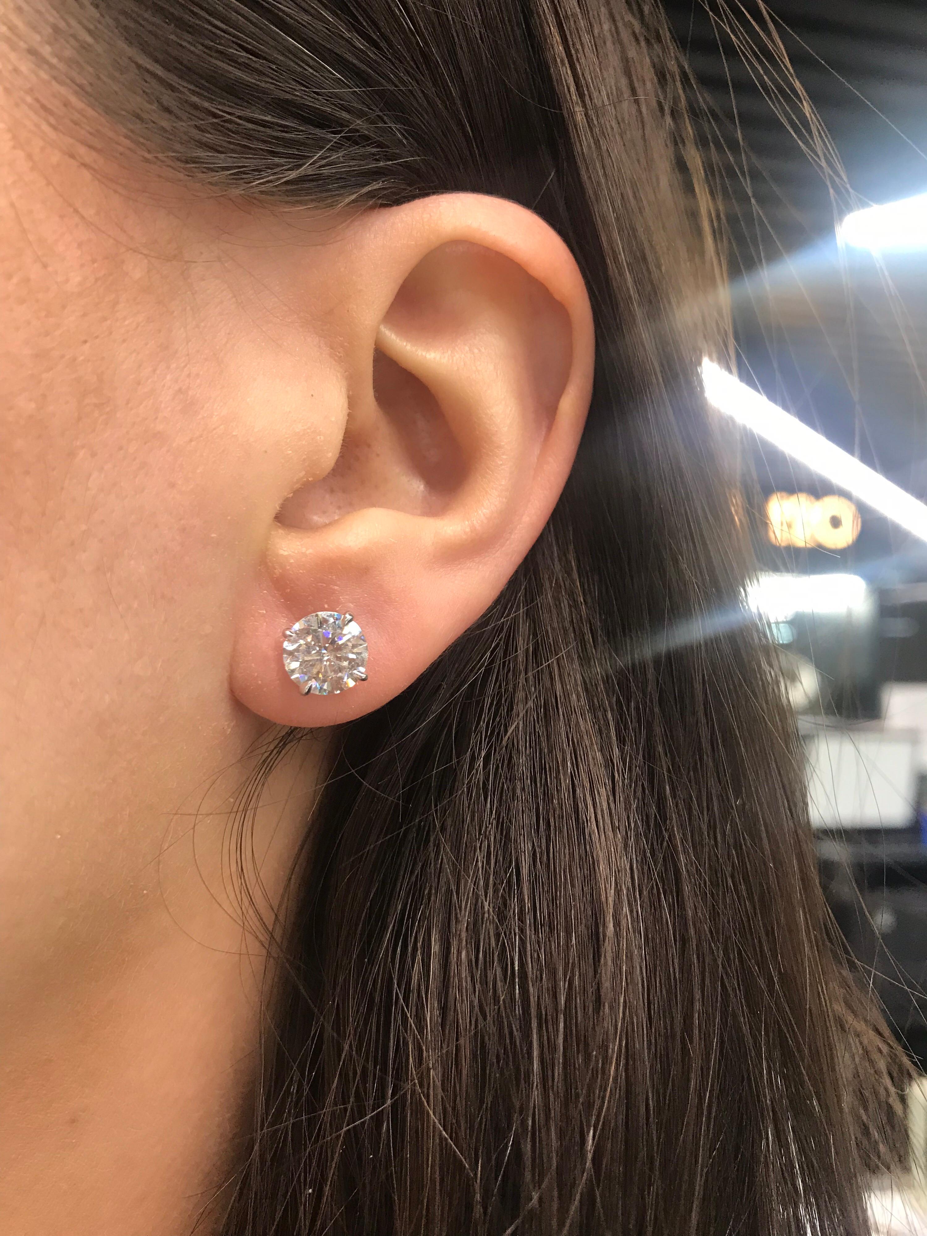 Diamond Stud earrings featuring two round brilliants weighing 4.19 carats in a 4 prong champagne setting, 18k white gold.
Color I-J
Clarity I1-I2