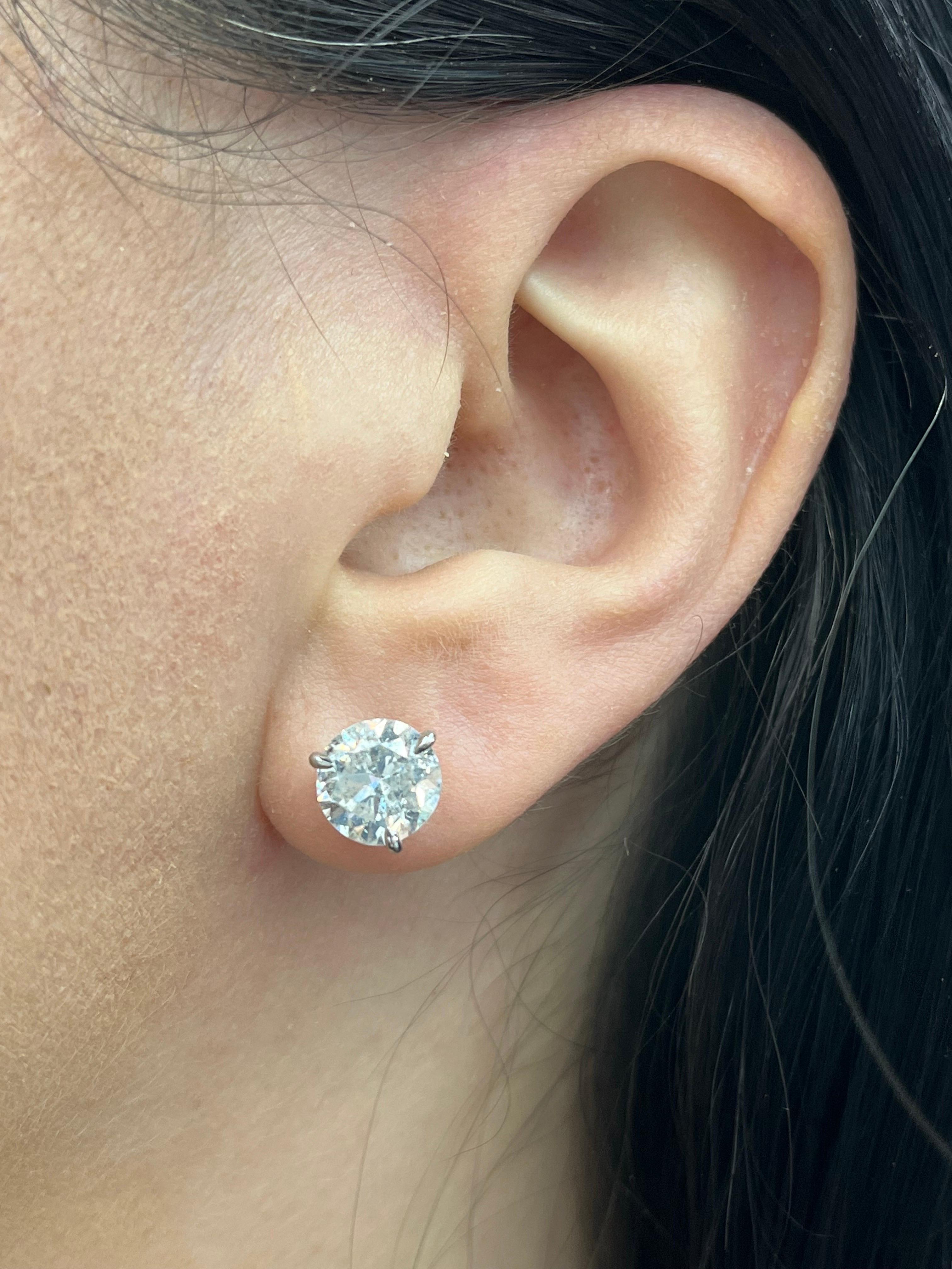 Diamond stud earrings weighing 4.66 Carats Color G-H Clarity I1 in a 3 prong Champagne setting.
Eye Cleanish & 7/10 Life

Setting can be changed to a Basket, Martini or Champagne/ 3 or 4 Prong/ 14 or 18 Karat.
DM for more Info & Videos on my