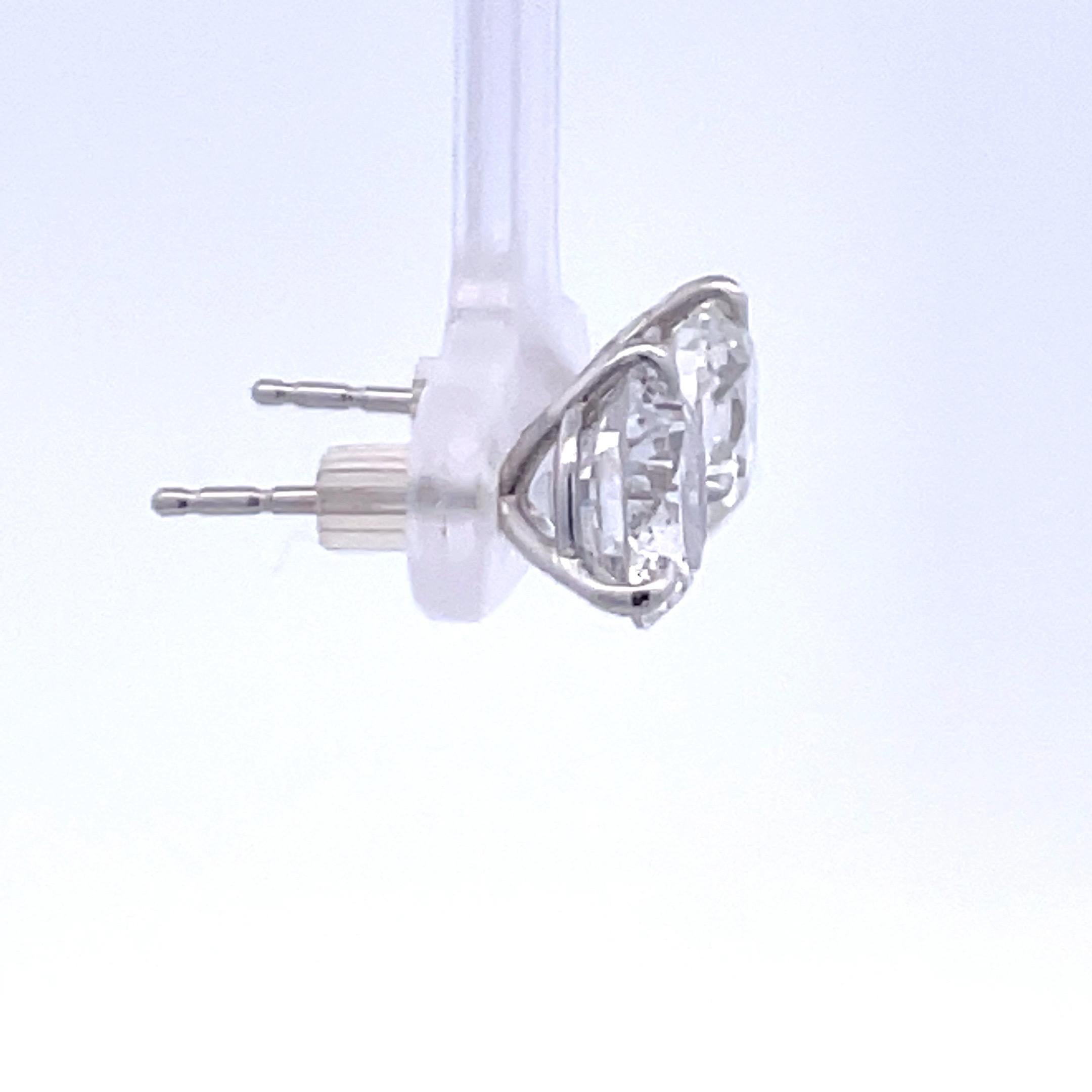 Contemporary Diamond Stud Earrings 4.66 Carats G-H I1 18 Karat White Gold Champagne Setting For Sale