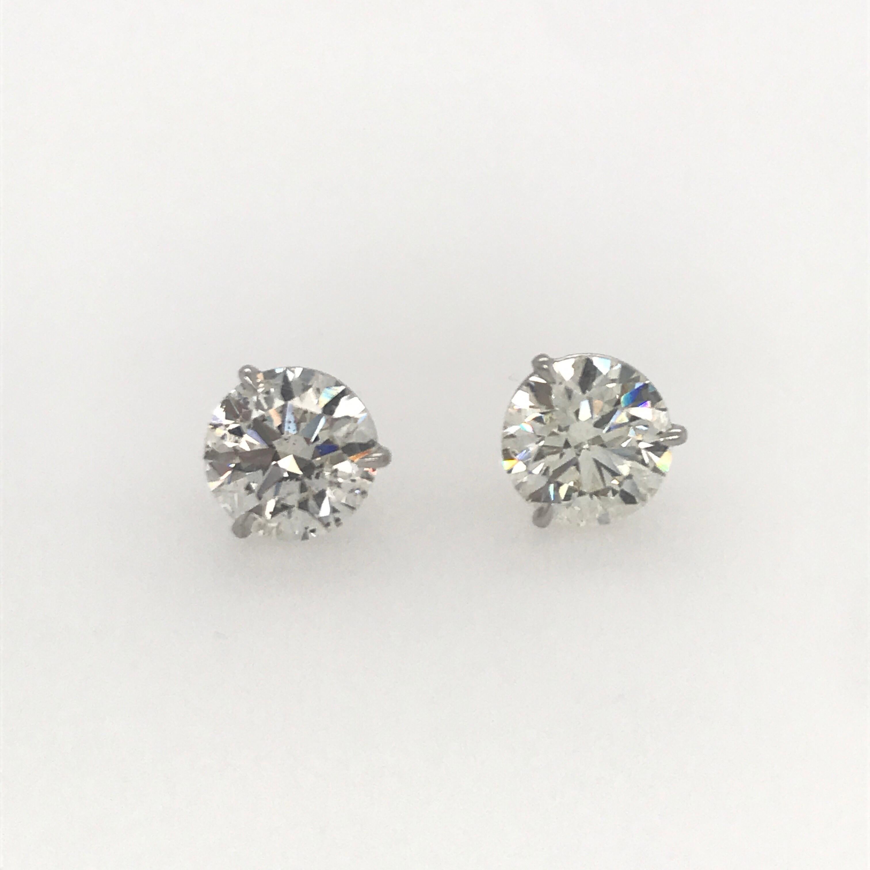 Diamond stud earrings weighing 4.81 carats in a 3 prong champagne setting.
Color I-J
Clarity I1